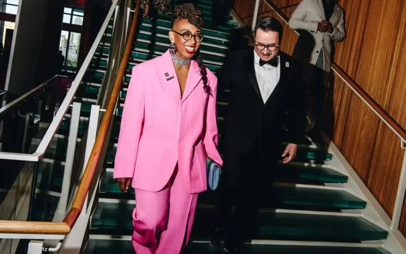 Kelley Robinson, president of the Human Rights Campaign, wearing a pink suit, styled by Jordan Jollon.