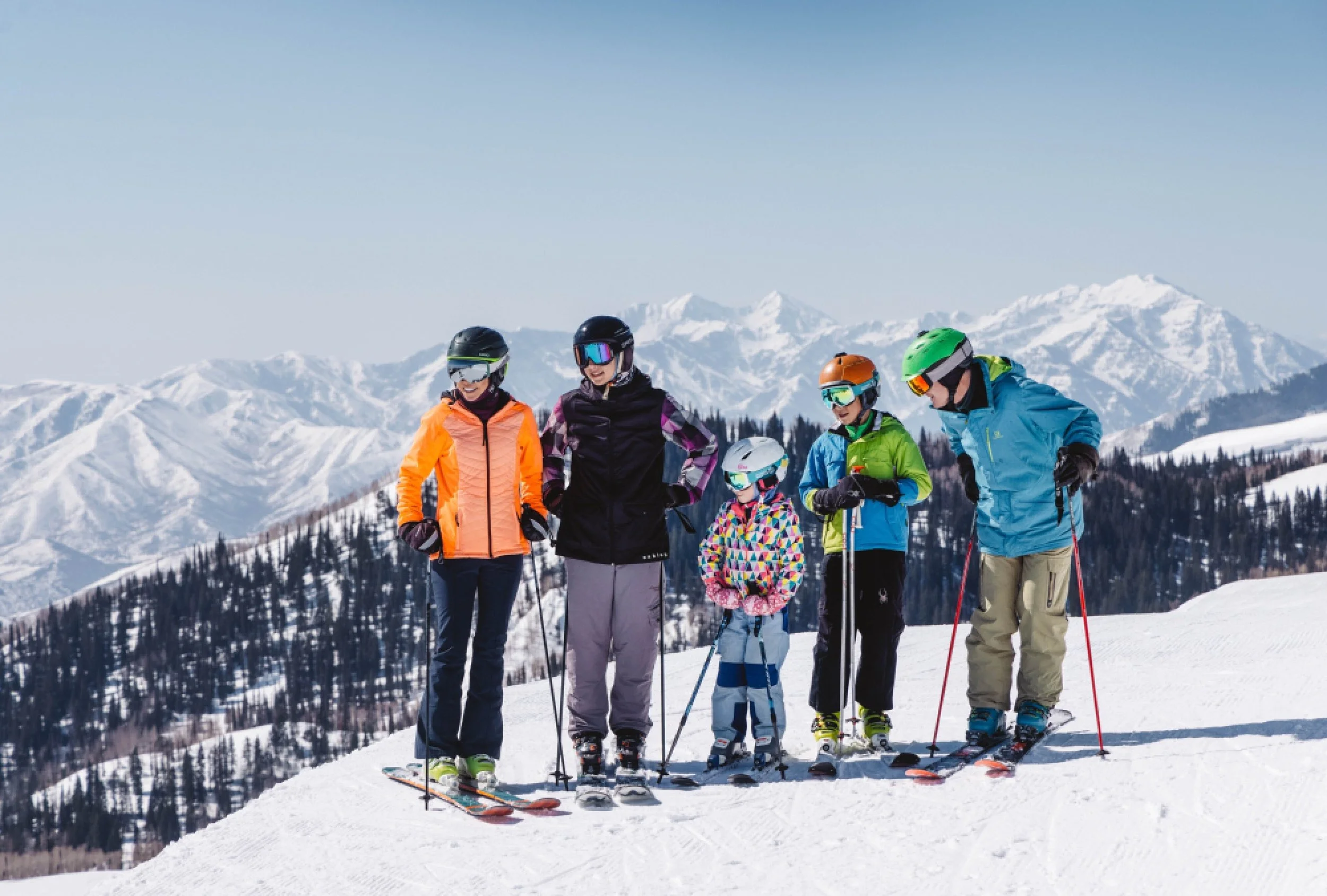 28-family-skiing-together-above-the-mountain-landscape.jpg