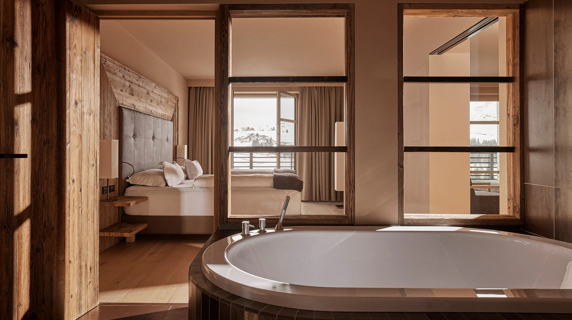 alpina-dolomites-bathroom-tub-and-bed-background.jpg