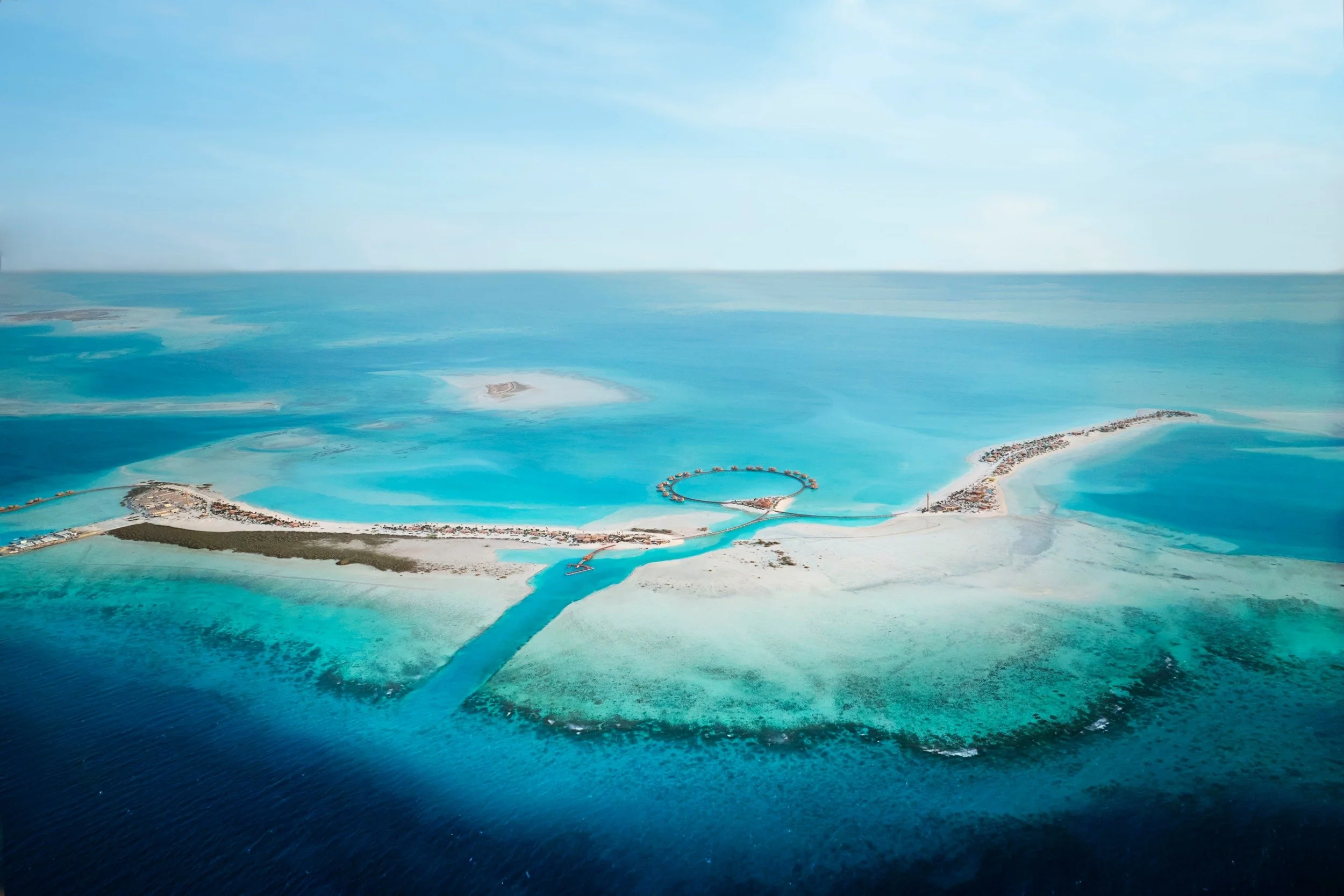 02-nujuma-island-and-surrounding-turquoise-waters.jpg