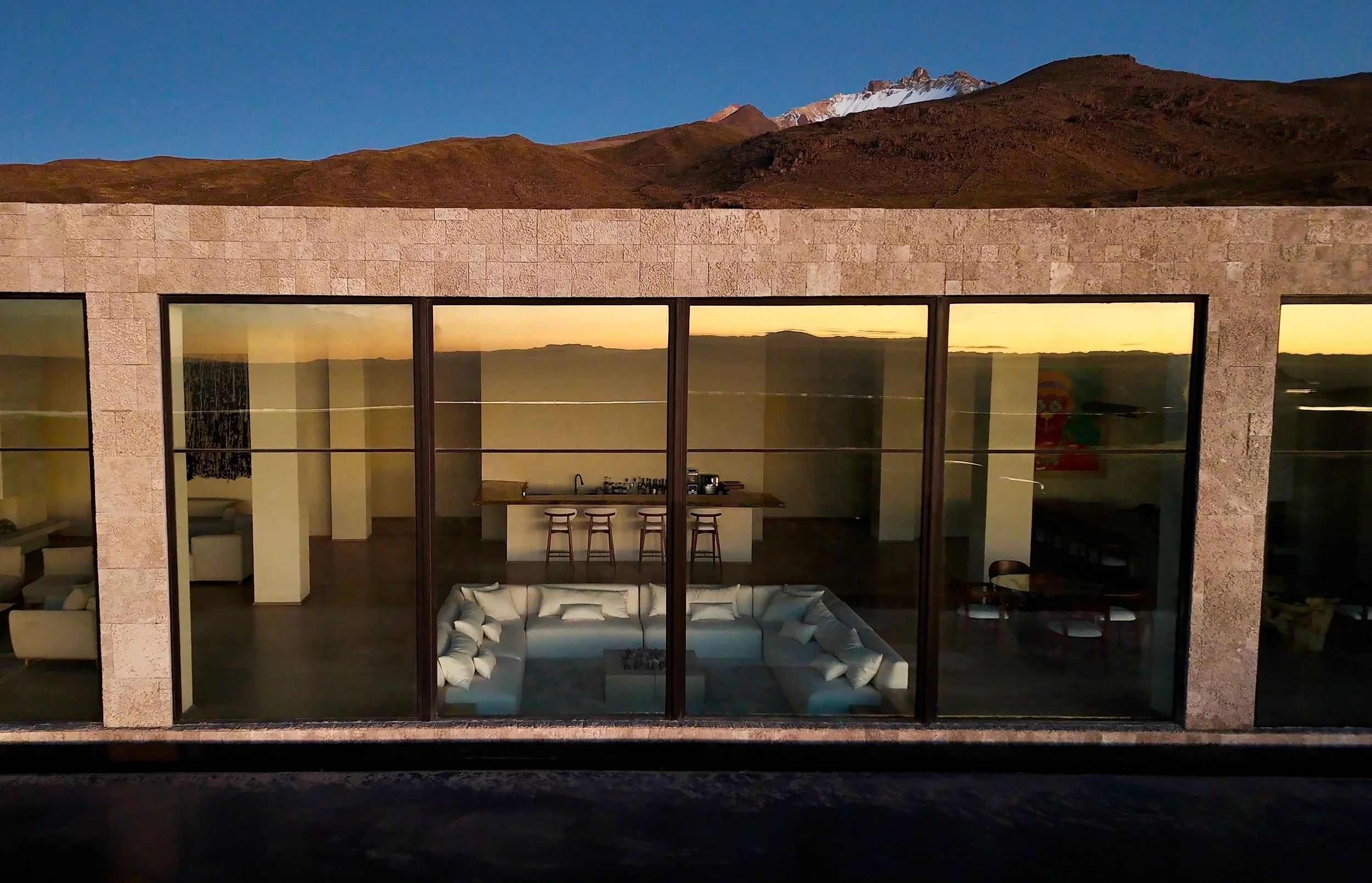 03-glazed-facade-reflecting-the-salar-at-dusk.jpg