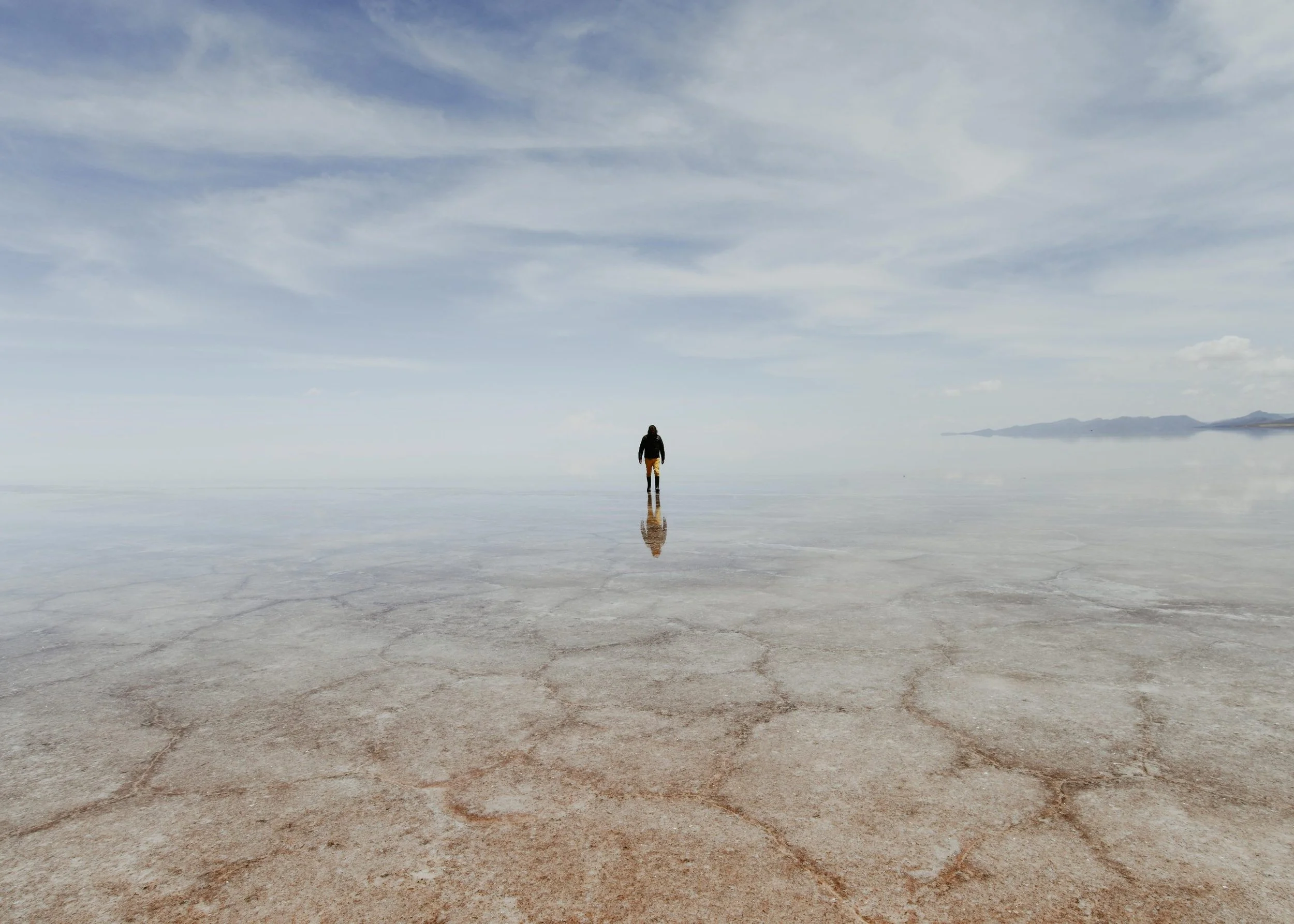 24-figure-in-a-reflective-salt-flat-landscape-from-the-gast-n-ugalde-biography-gallery.jpg
