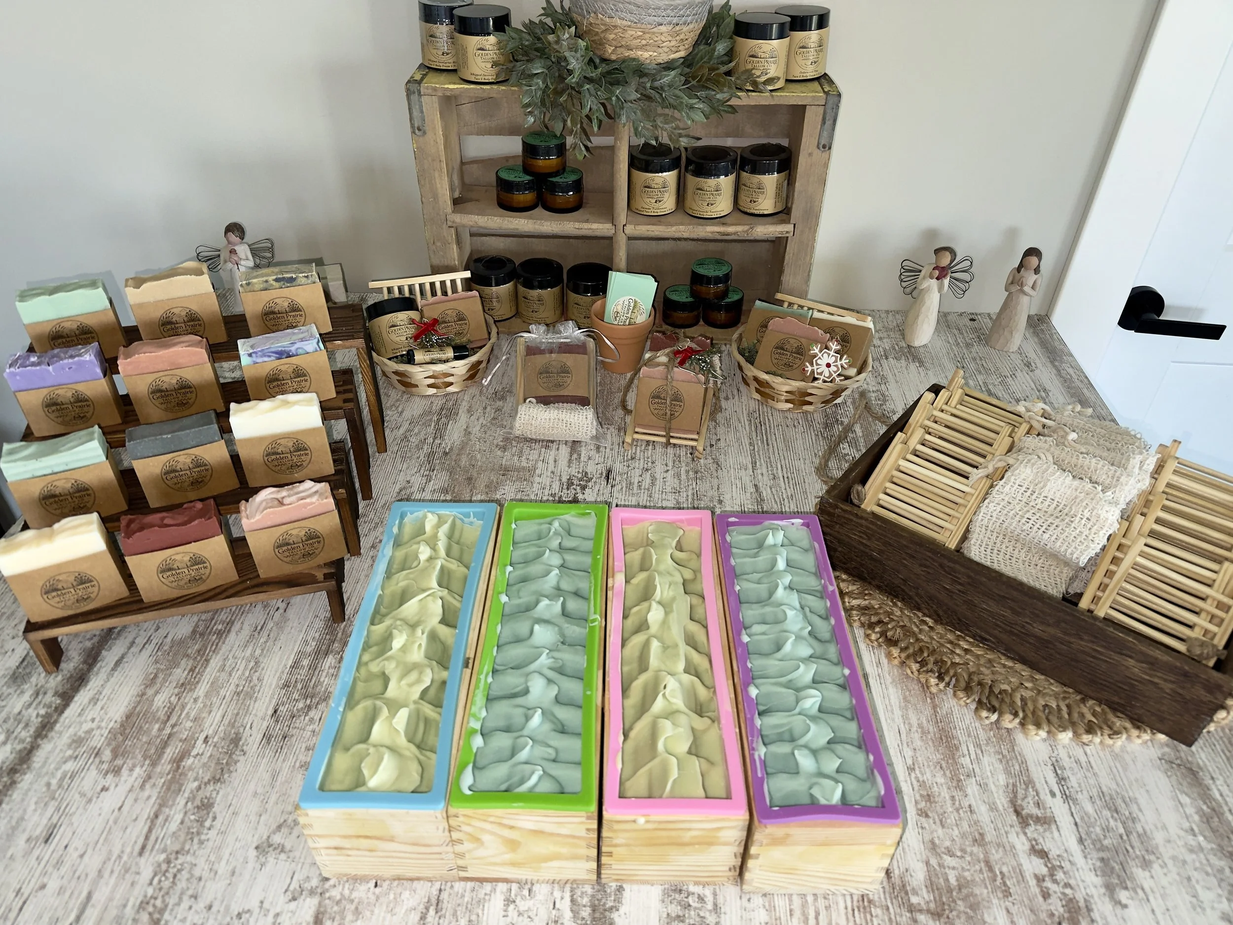 Display of handmade tallow soaps, tallow balms, tallow lip balm, tallow for your dog and gift baskets.