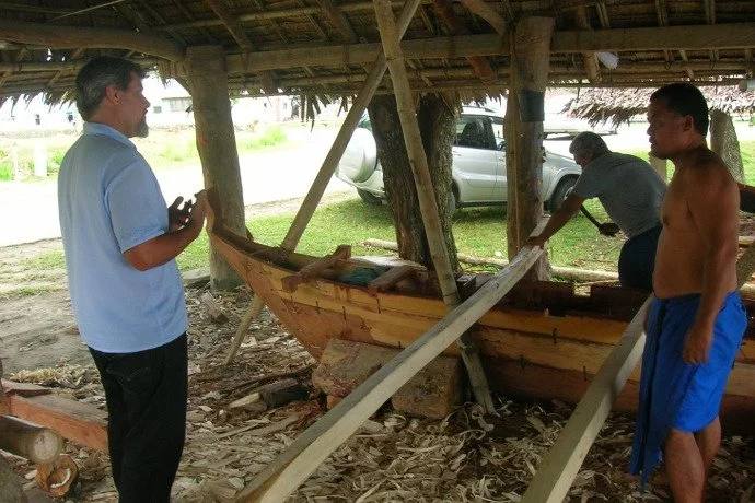 Justin Rose with canoe builders working on a traditional canoe