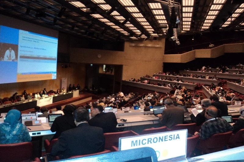 Plenary session of an international environmental treaty meeting, with the Micronesia nameplate in the foreground