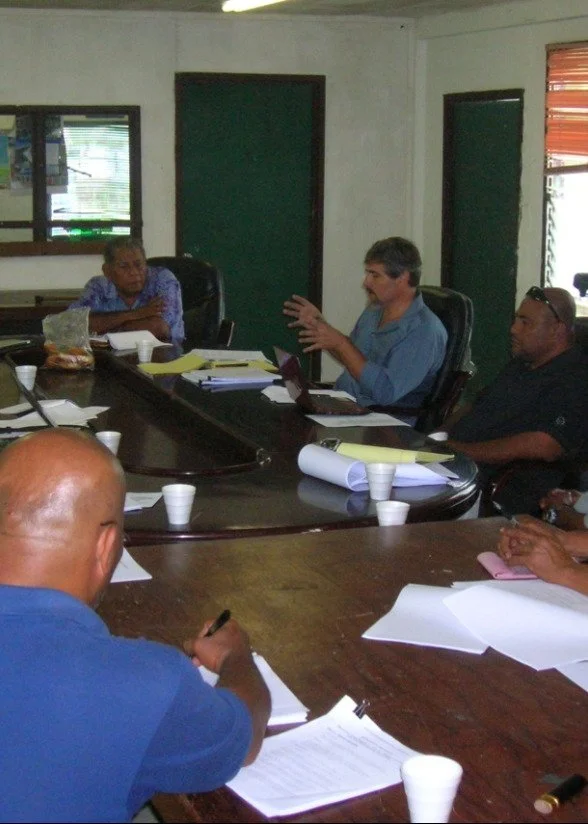 Justin Rose speaking at a consultation meeting around a conference table