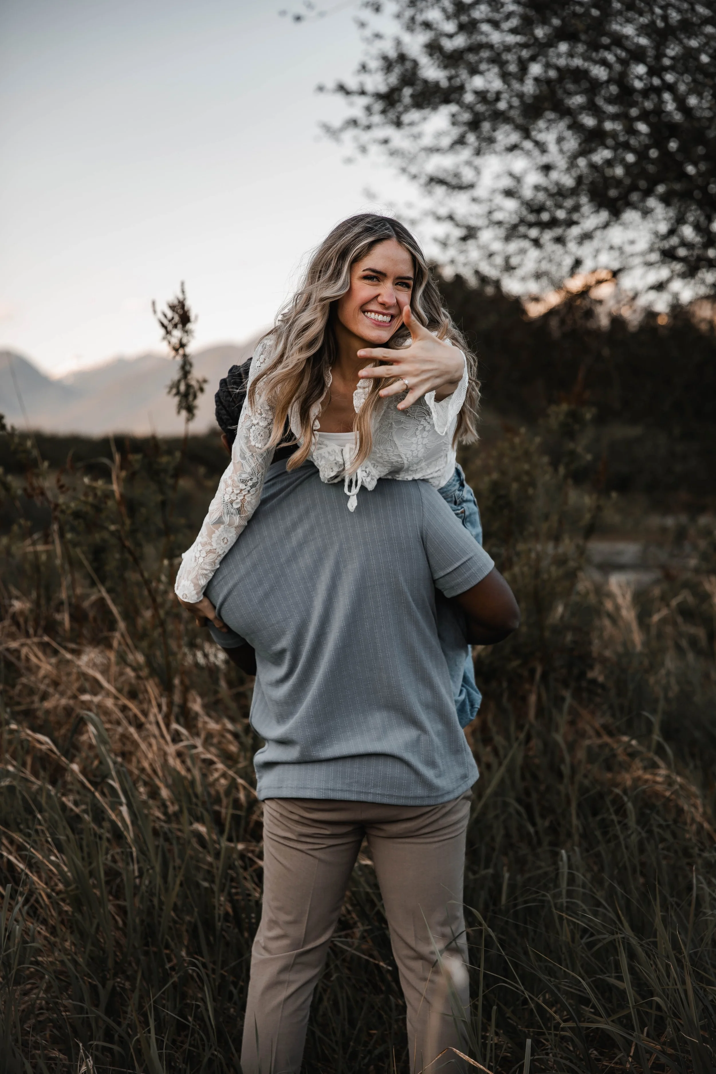 Golden hour engagement session at Pitt Lake surrounded by beautiful mountain scenery.