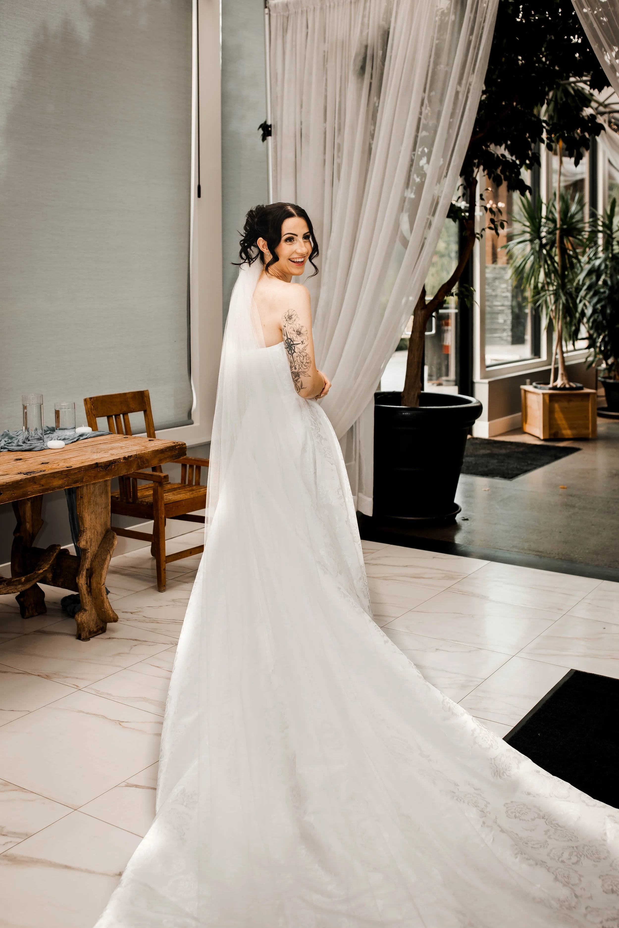 Bride posing in her white wedding gown before her Bridlewoods wedding ceremony.