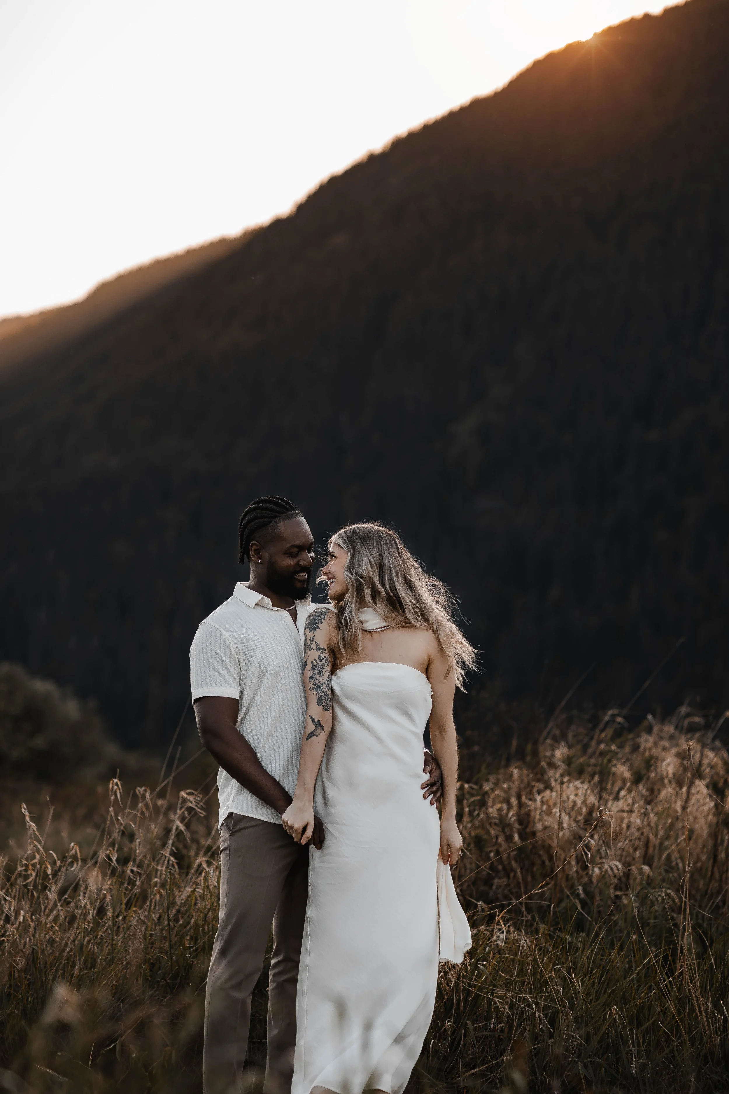 Romantic couple portraits with stunning mountain views at Pitt Lake, BC.