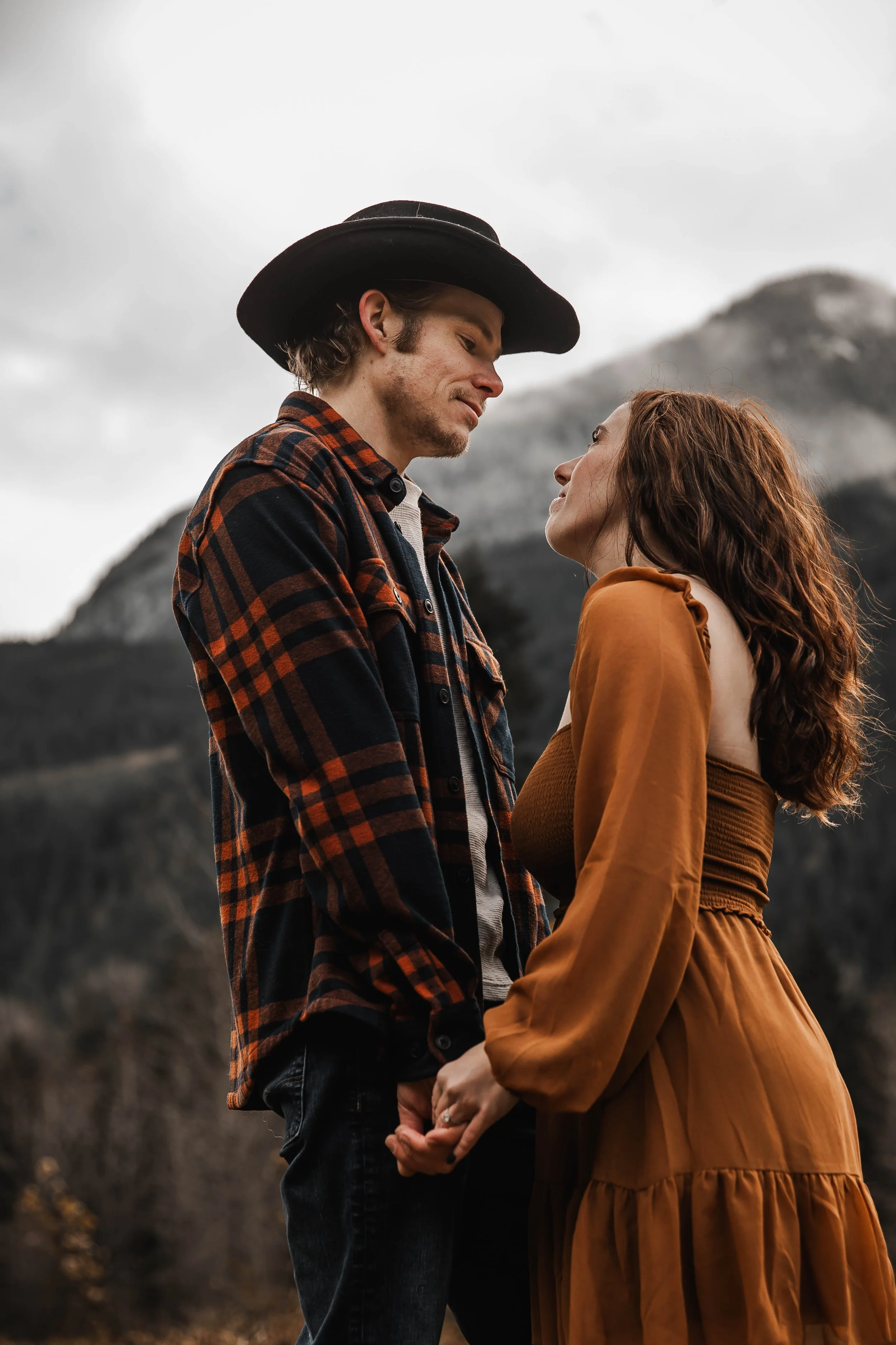 Artistic engagement portraits with a warm, romantic photography style.