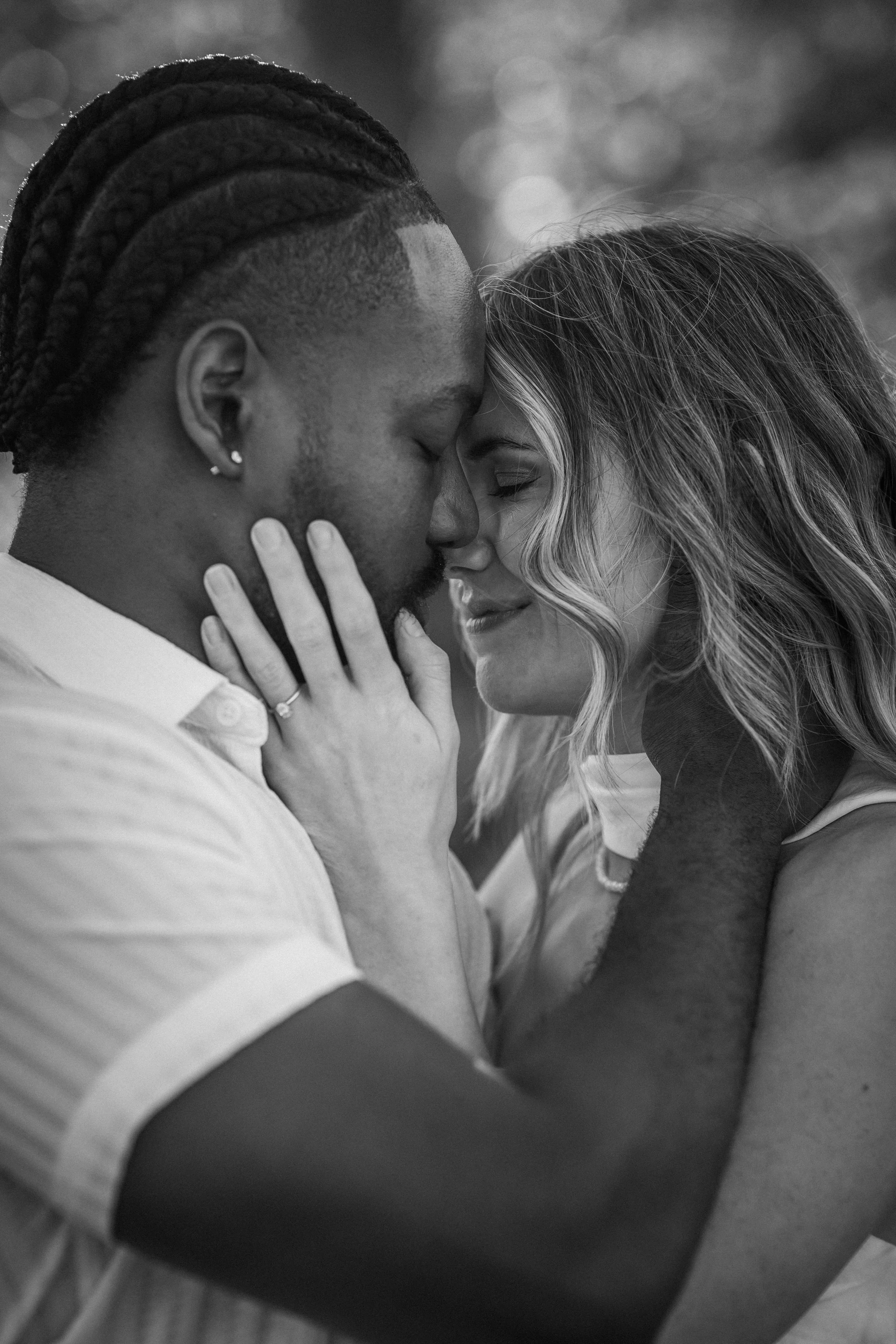 Outdoor engagement photography with mountain views and romantic natural light.