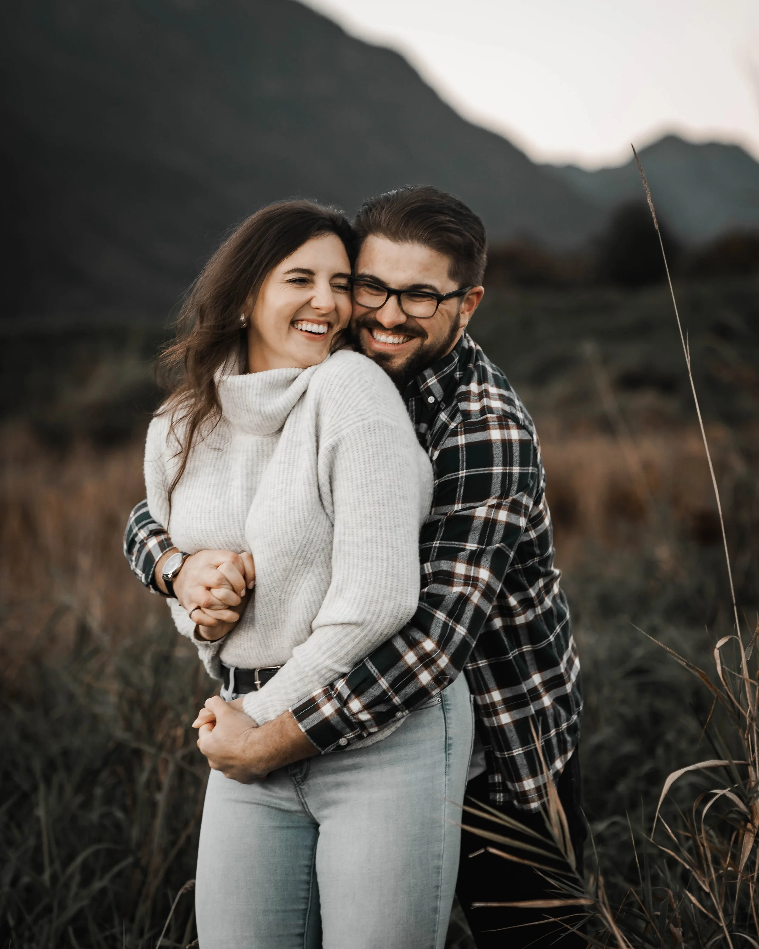 Dreamy sunset engagement session at Pitt Lake with warm golden light.