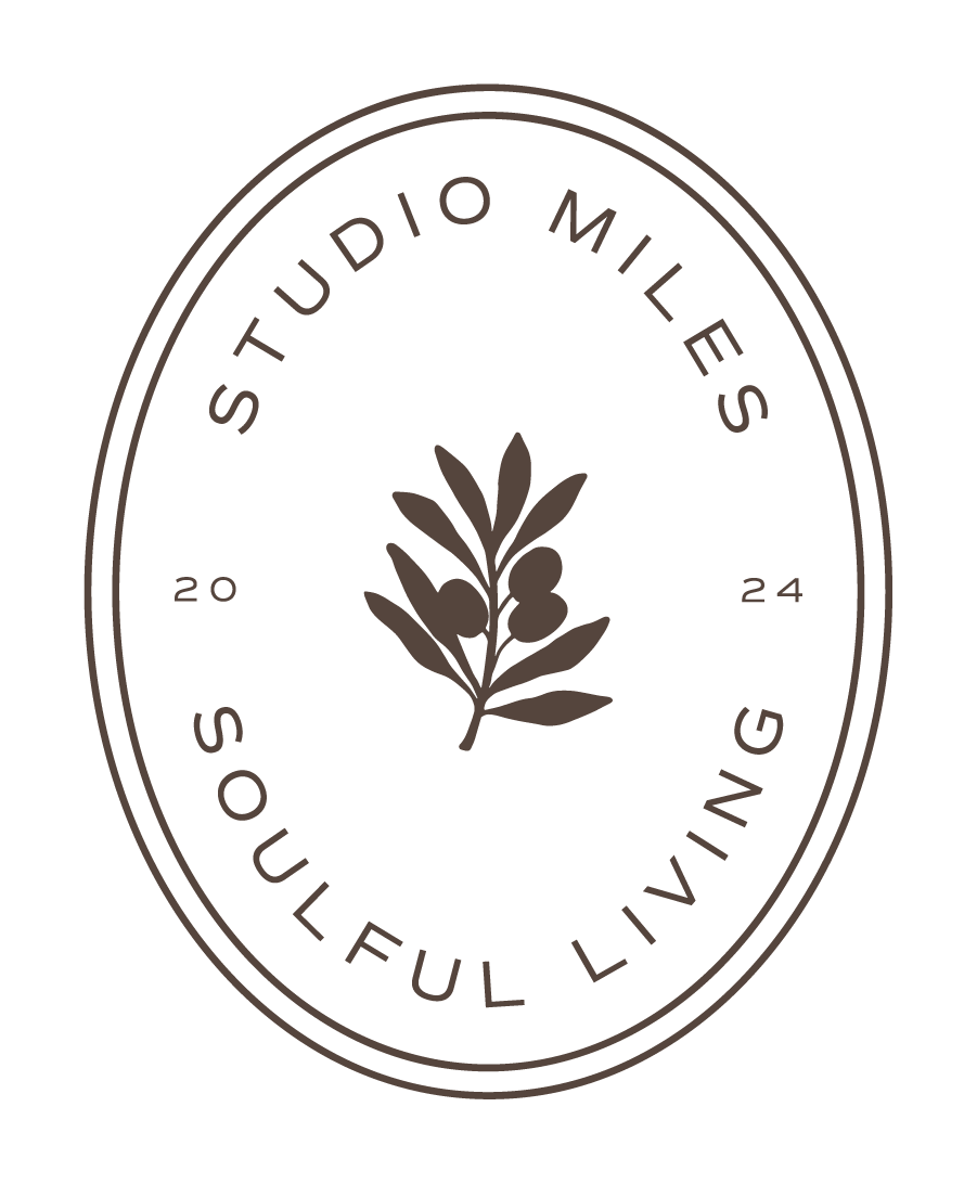 Logo with the text "Studio Miles Soulful Living" encircling a simple illustration of a leafy plant in the center.
