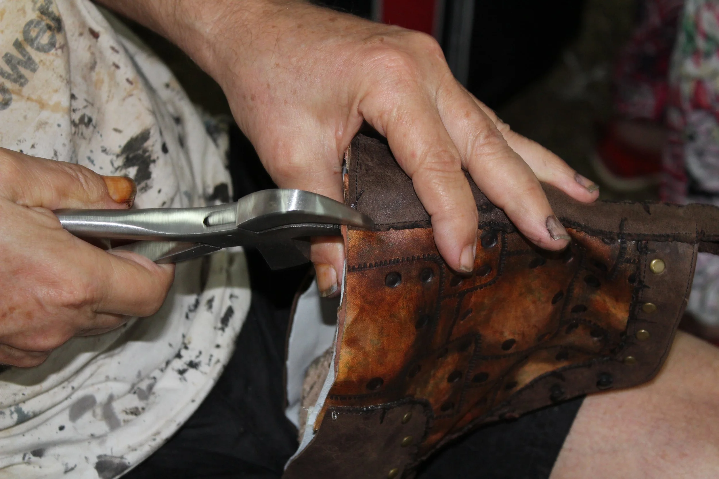 A person lasting a boot in our 5-day boot making workshop