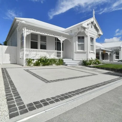 Concrete driveway with contrasting decorative borders.