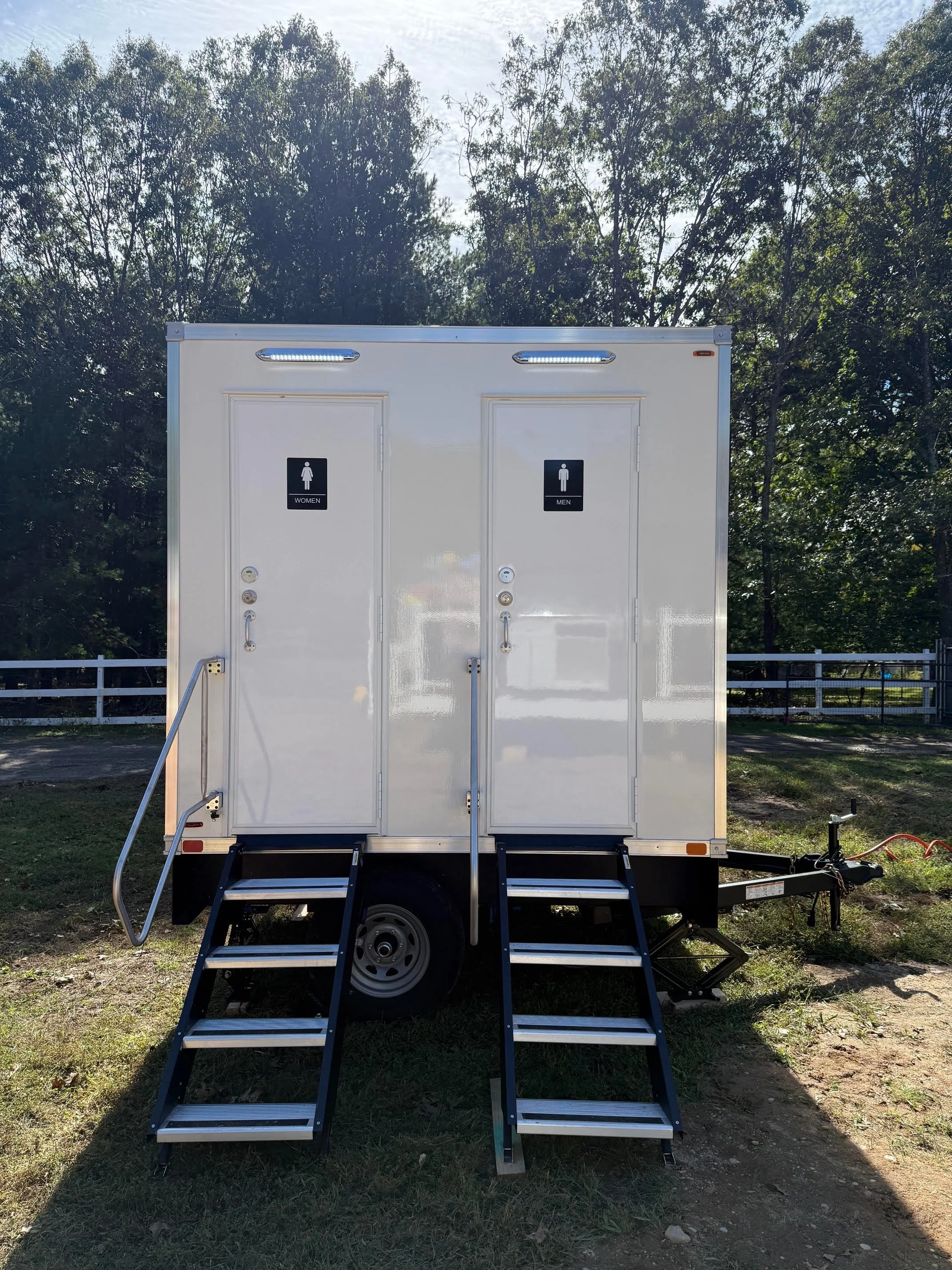 ECO 2-stall restroom trailer photographed from the exterior.