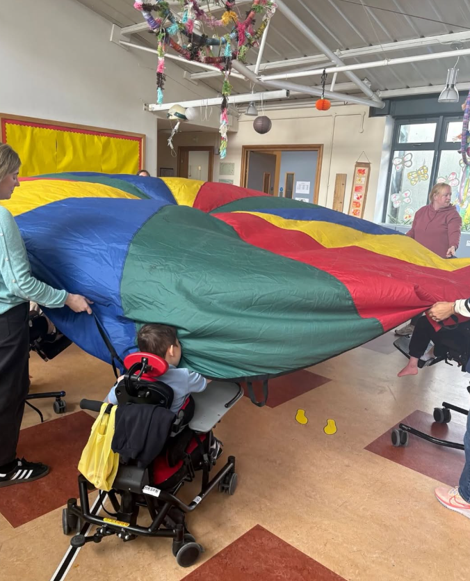 Students using the parachute in our general purpose area