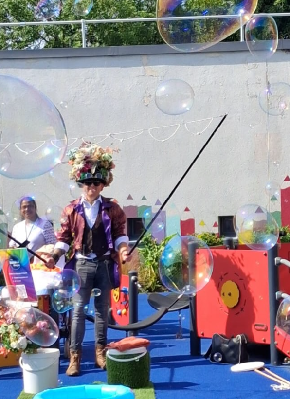 Students enjoying a bubble show at school