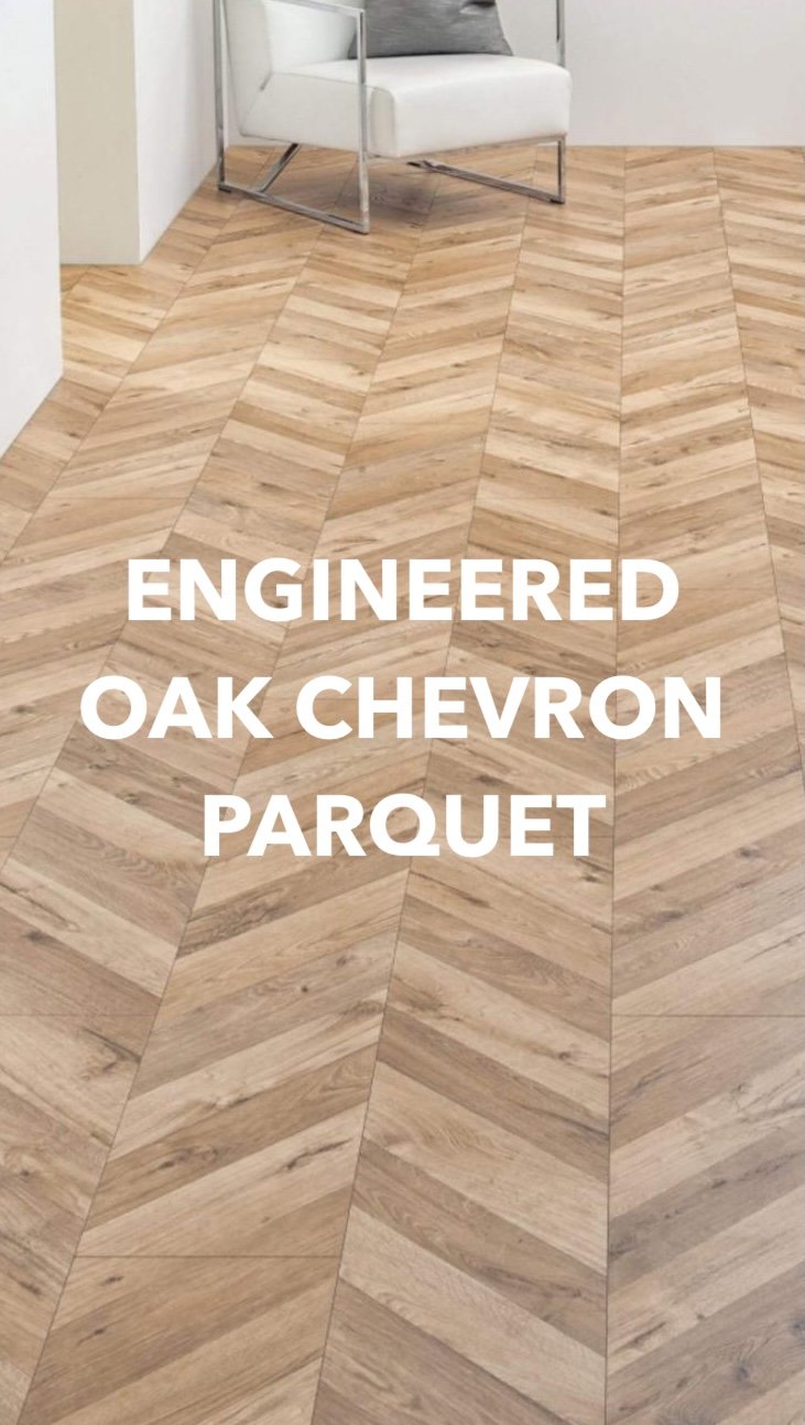 Engineered oak chevron parquet flooring beside a white chair.