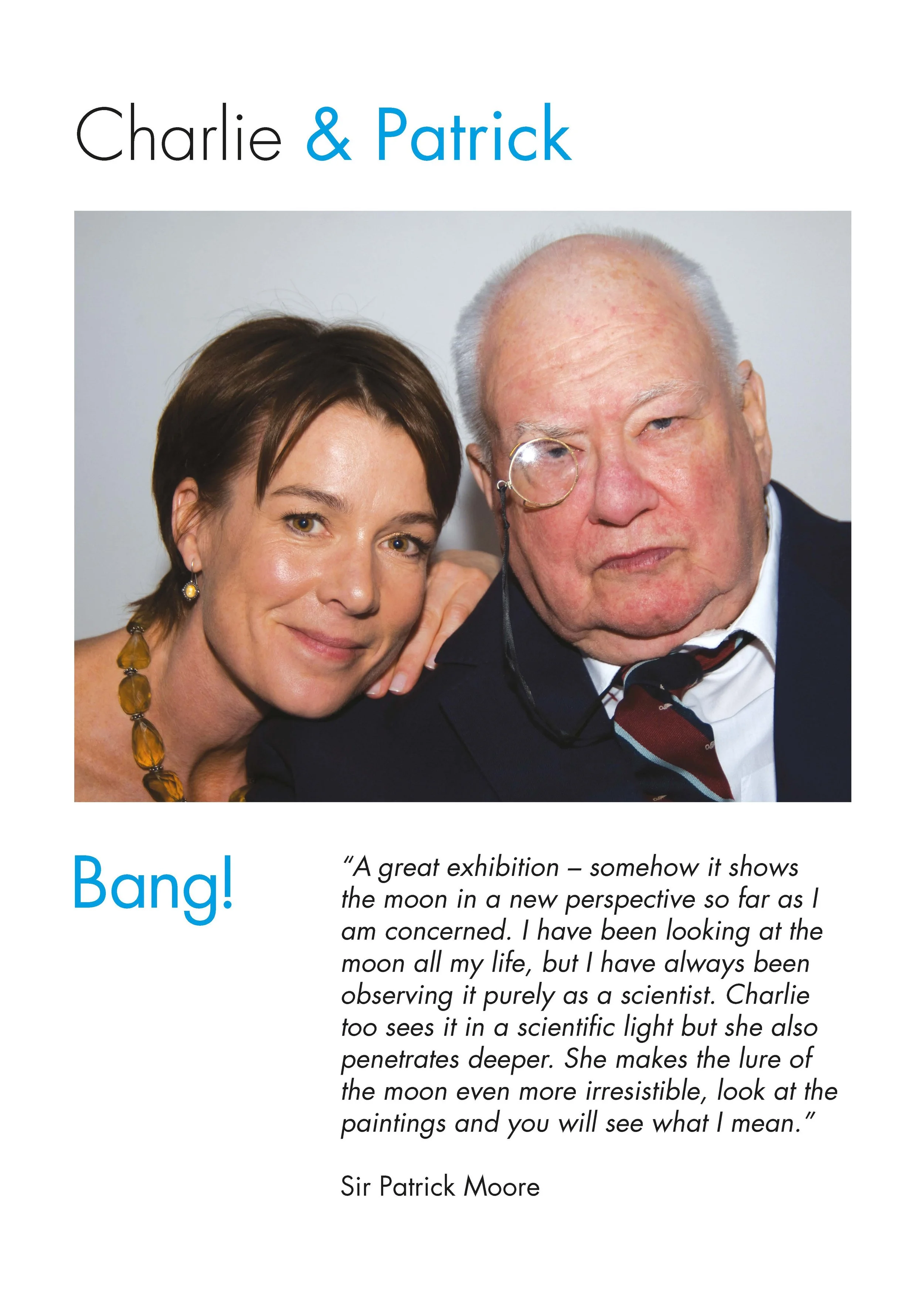 A woman with short brown hair, wearing drop earrings and a necklace with amber beads, smiling with her hand near her face, next to an older man with gray hair, wearing a dark suit, white shirt, colorful tie, and a monocle, both looking at the camera.