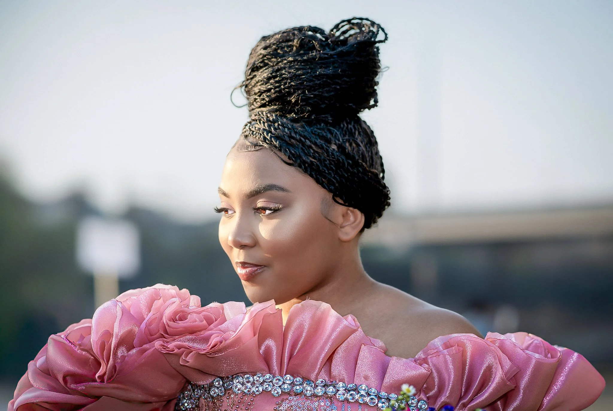 Editorial portrait of a woman in a pink ruffled prom gown, Columbus, Georgia