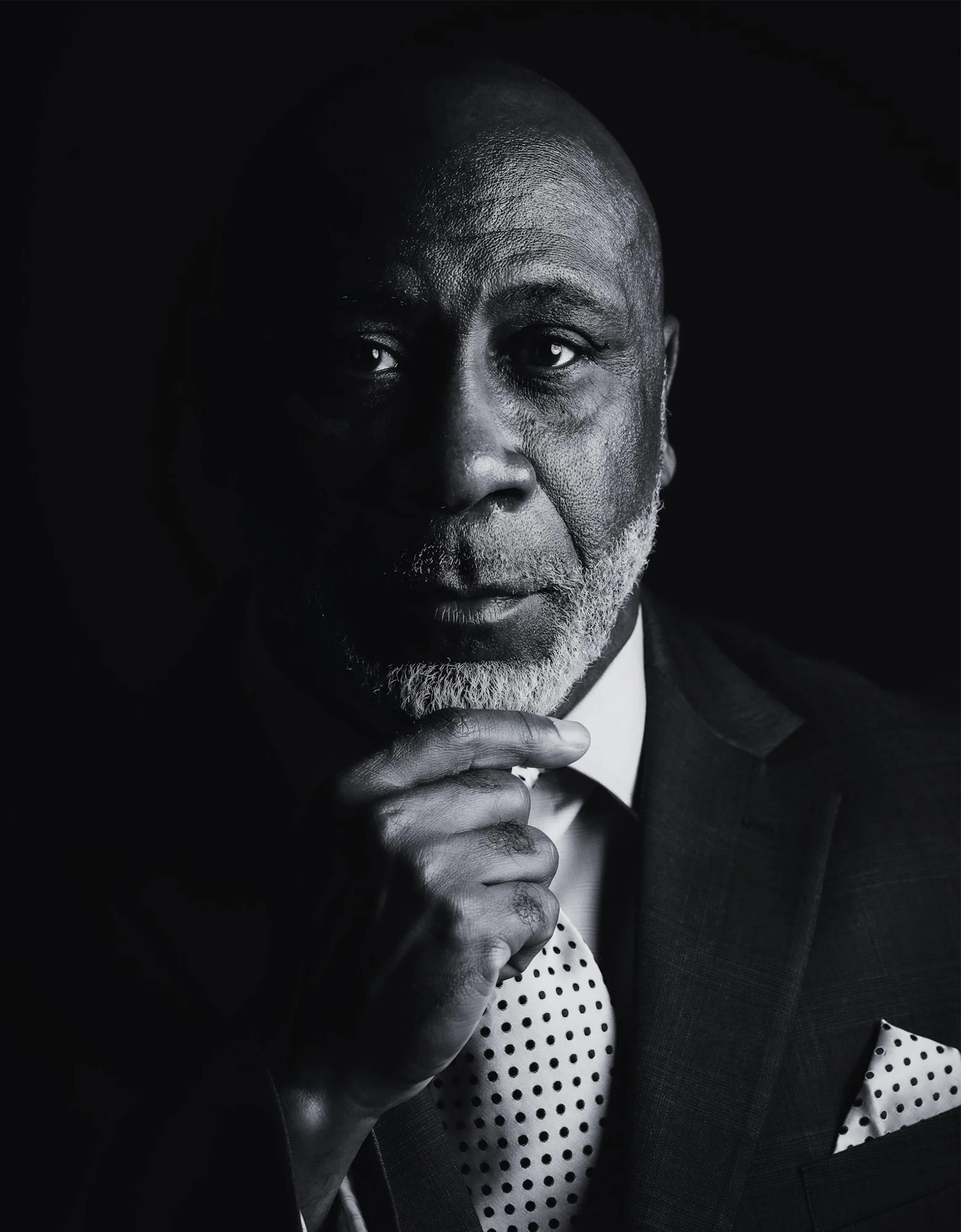 Black and white noir portrait of a gentleman in a suit. Linda Luttrell Studio, Columbus, GA
