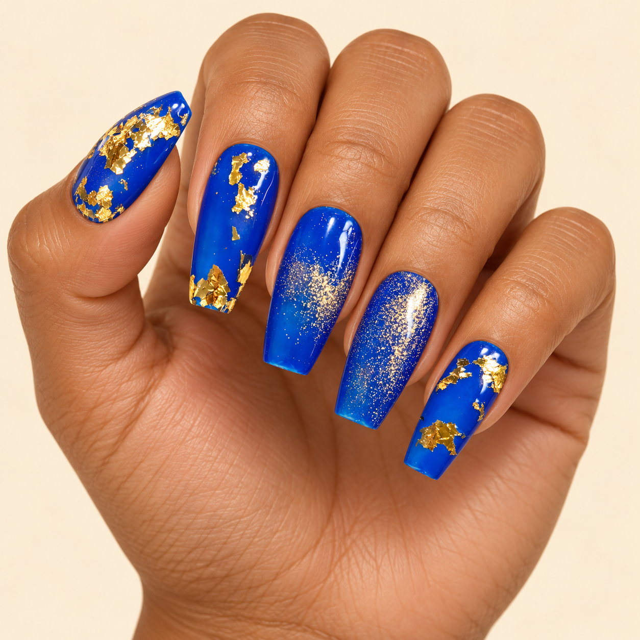 Cobalt and gold foil manicure.png