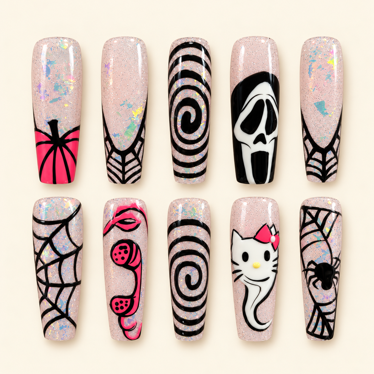 Ten spooky press-on nails in flat lay.png
