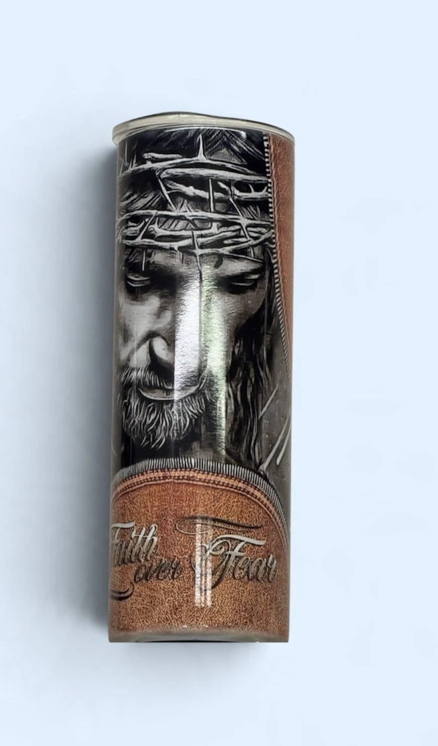 A cigar box with a black-and-white image of Jesus Christ wearing a crown of thorns on the front. The box has the words "The Lord's Tears" written on it.