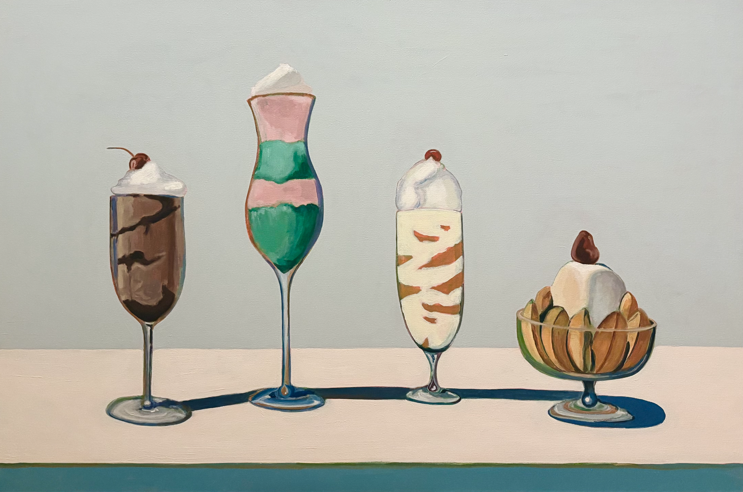 four frozen deserts sit on a powder blue background