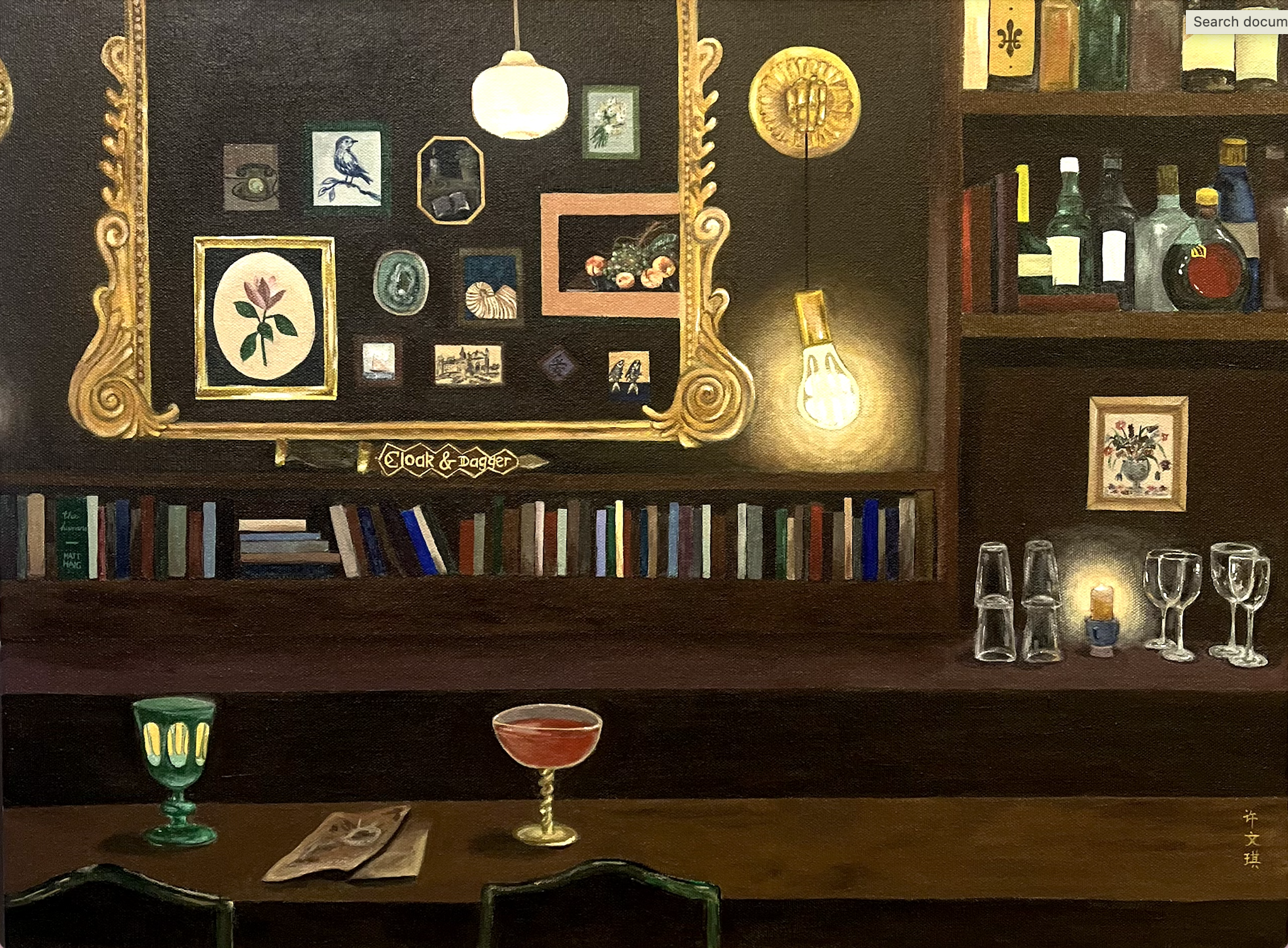 the viewer faces a bar on which two drinks sit. a large mirror reflects a gallery wall, under which a shelf displays books lined up spine-to-spine. a lightbulb hangs next to shelves of glasses and liquor bottles
