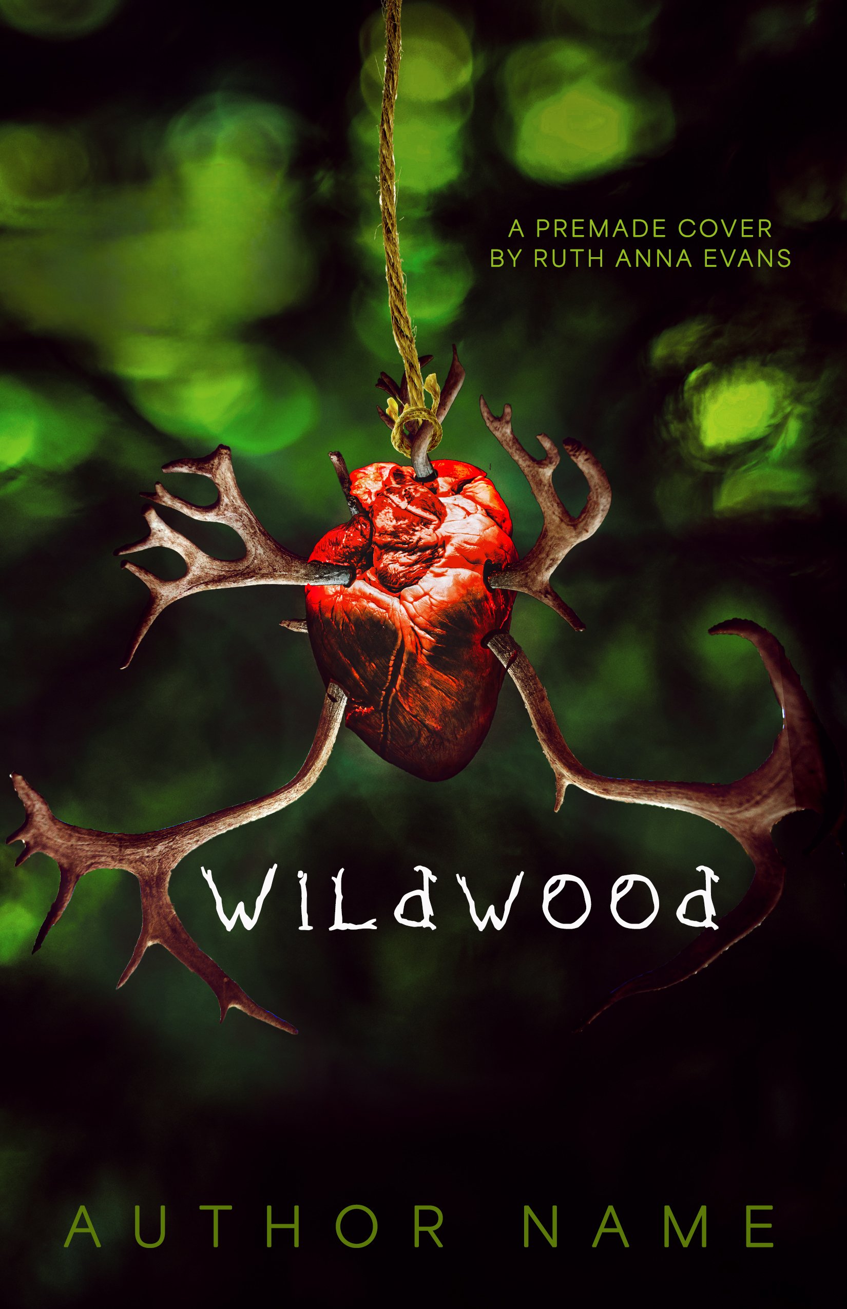 Book cover titled "Wildwood" featuring a red animal heart with antlers hanging from a rope against a green, blurred forest background, with text "A Premade Cover by Ruth Anna Evans" and placeholder text "Author Name".
