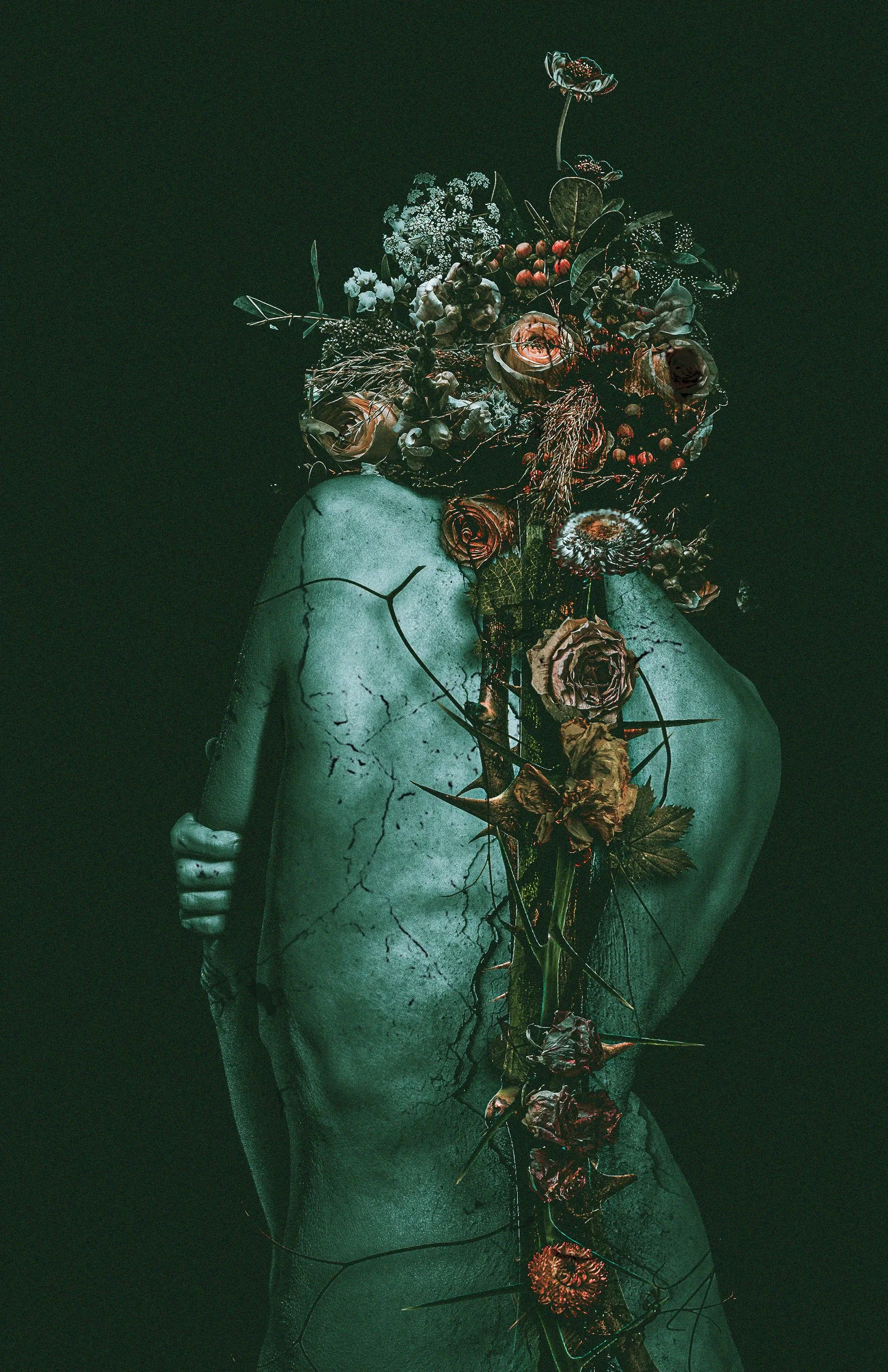 A corpse with cracked skin and arms crossed over the chest, covered with a variety of flowers, leaves, and thorns, against a dark background.