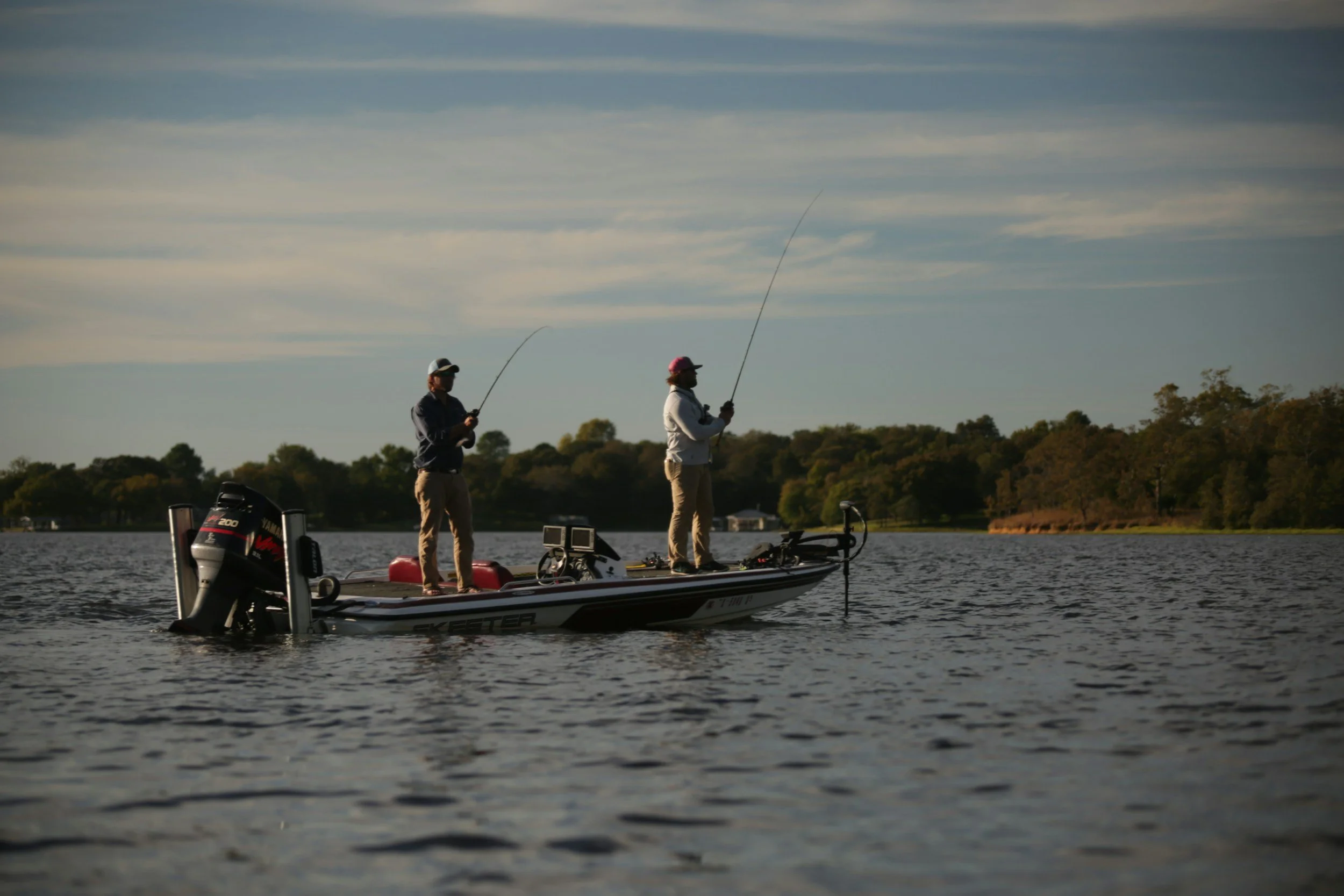 Anglers fly fishing from a skiff on the water — stock photograph by Richard R