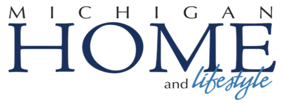 The text 'Michigan Home and Lifestyle' with 'Michigan' in black uppercase letters, 'Home' in large blue uppercase letters, and 'lifestyle' in blue cursive script.