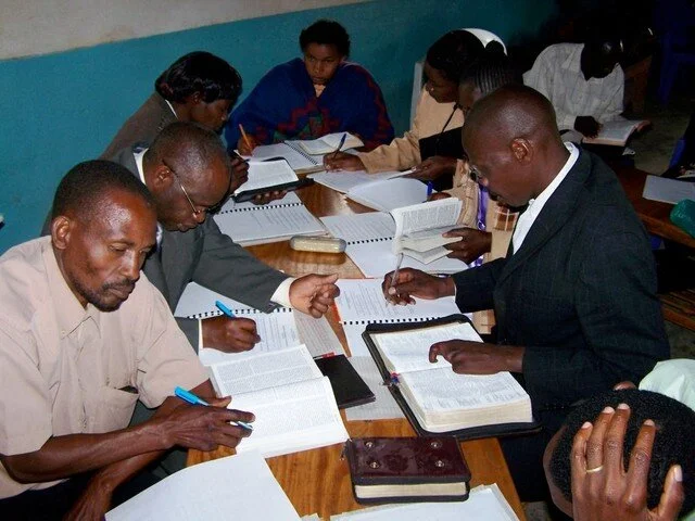 Pastors studying Scripture together in a BLLC classroom