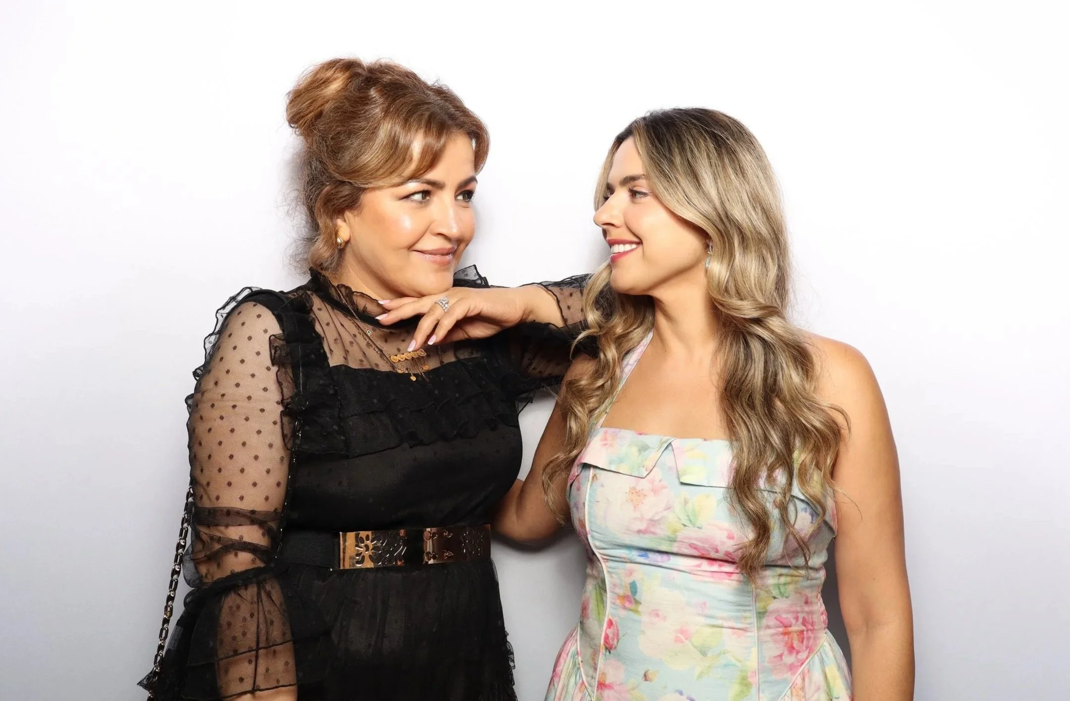 Women posing at wedding photo booth los in Los Angeles