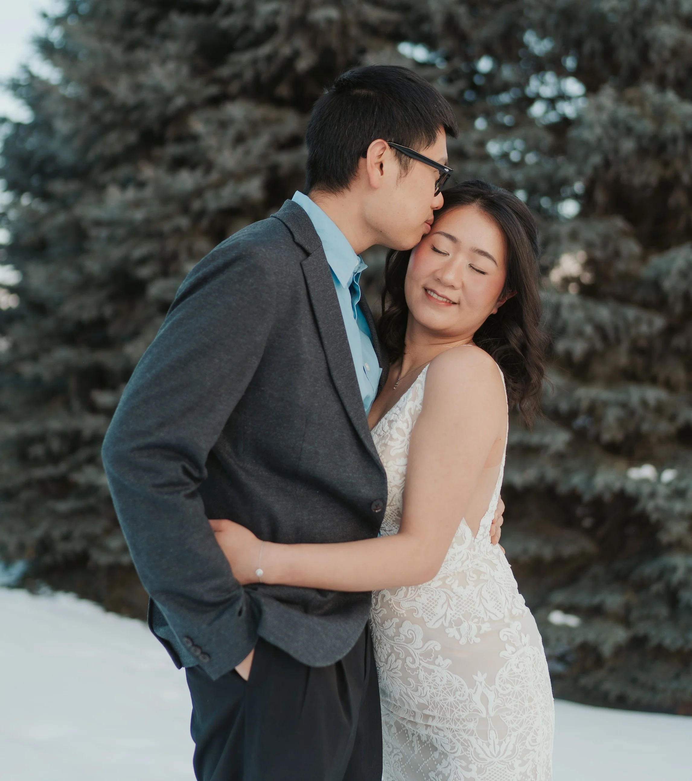 Blushing bride makeup with romantic half-up half-down hairstyling and groom's makeup