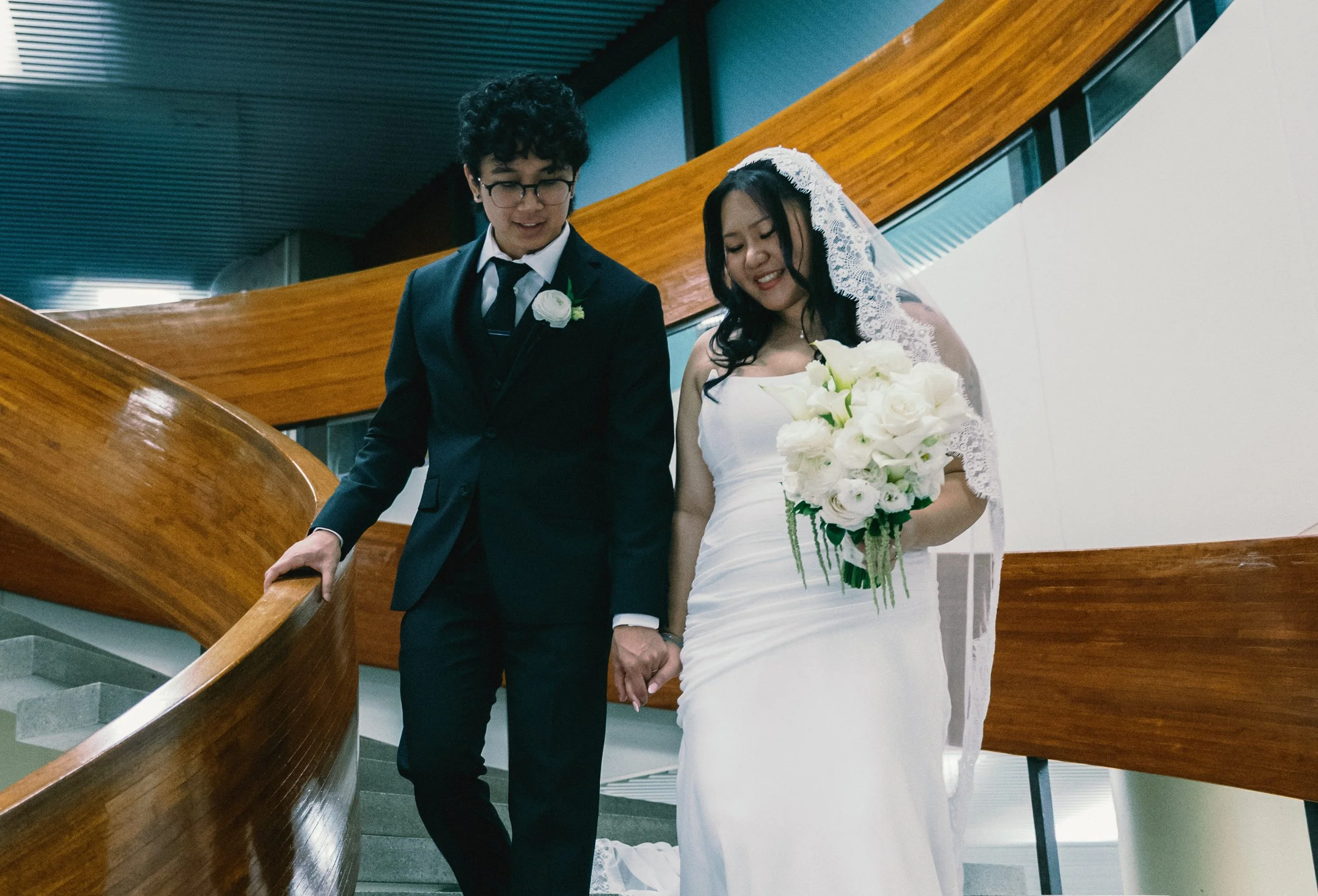 Romantic bridal hairstyling with cathedral veil and natural wedding makeup
