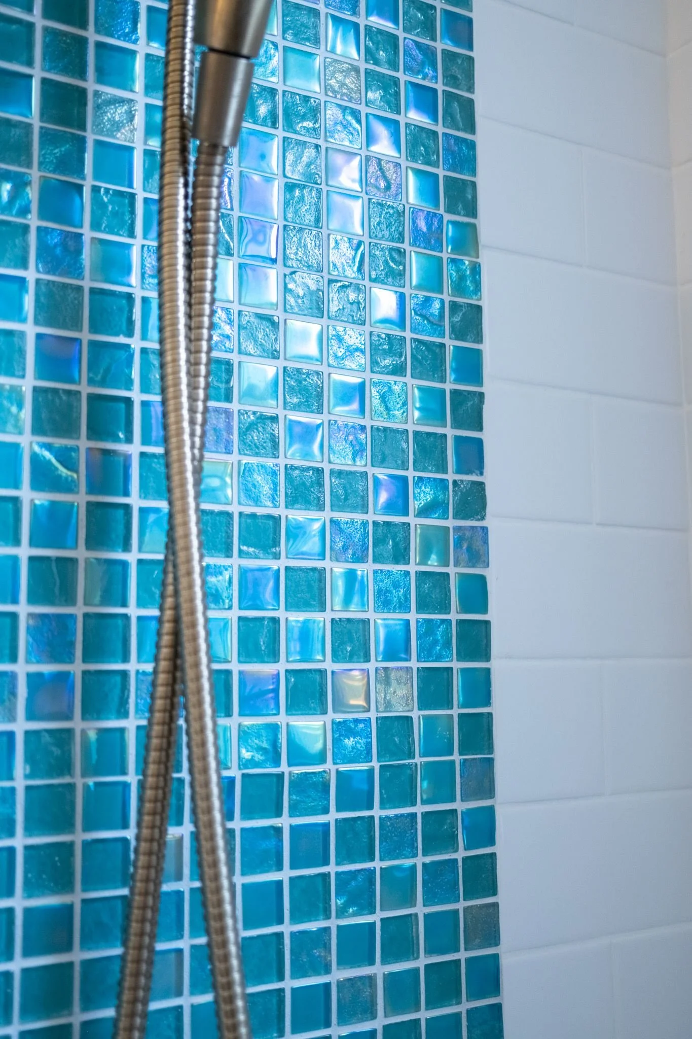 Bathroom shower with blue glass mosaic accent strip