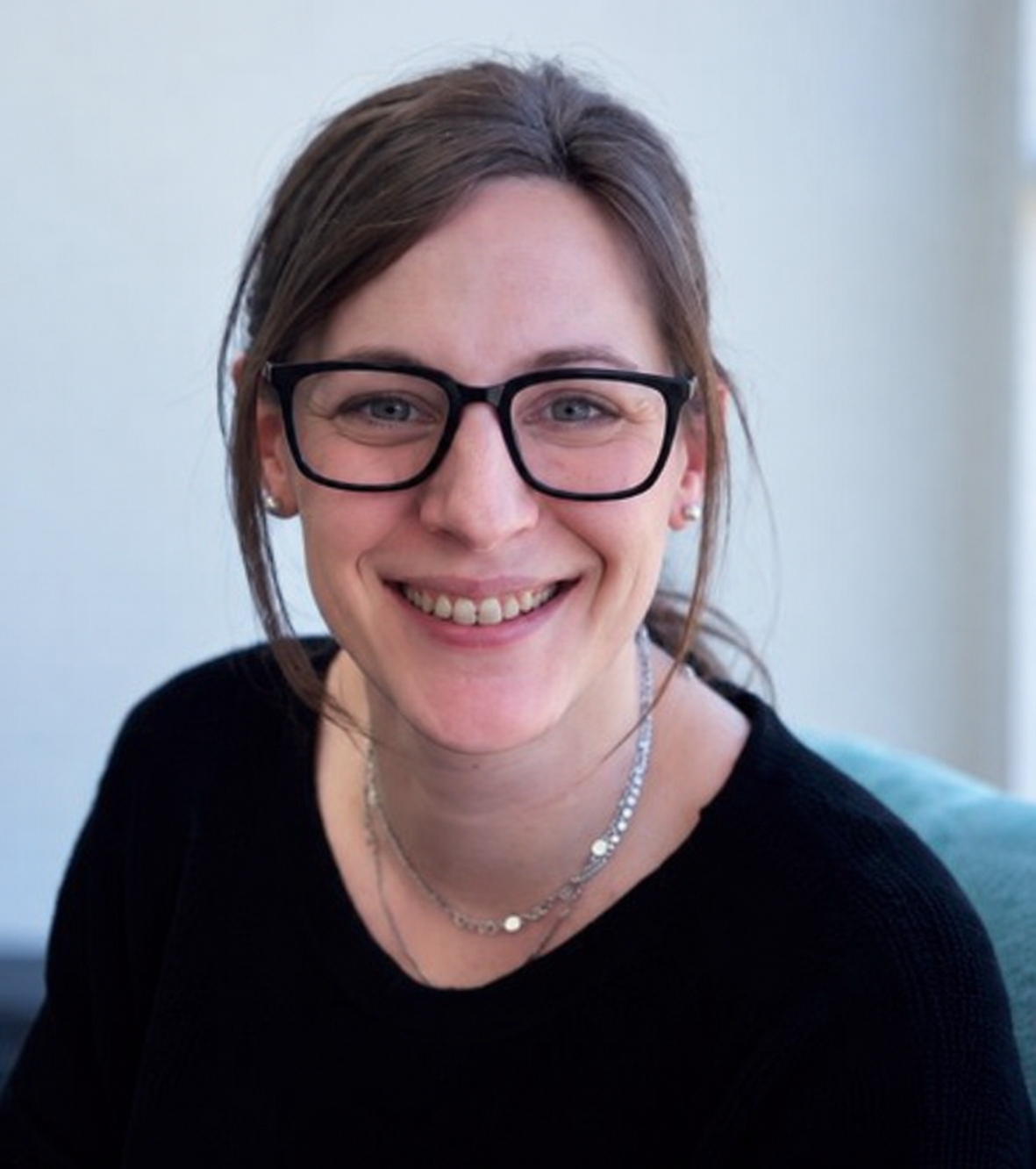 Eliza Kelly, Director and Behaviour Support Practitioner at Empathia Support Services, smiling at the camera.