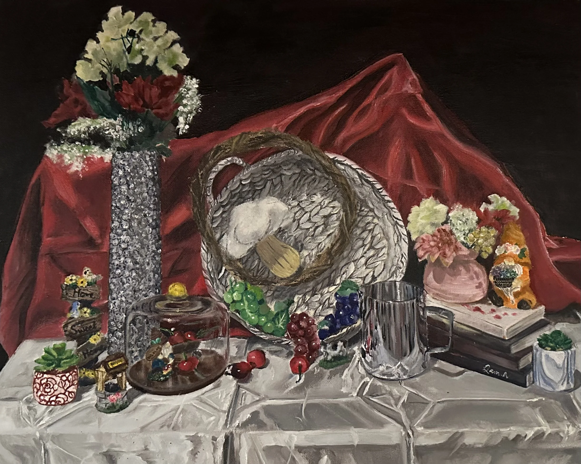 Still life painting of a table with various fruits, flowers, baskets, vases, and decorative objects, with a red draped cloth and a dark background.