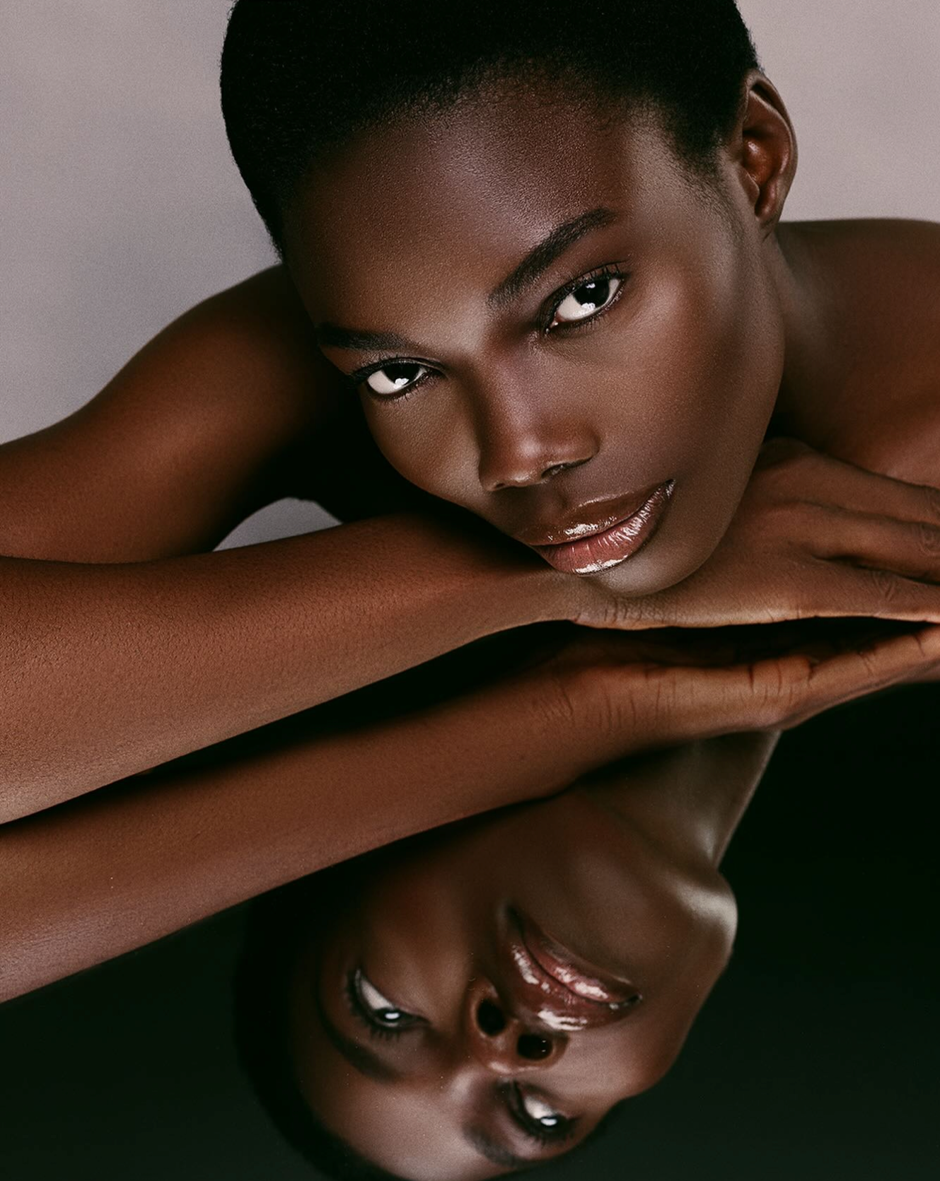 Close-up studio beauty portrait featuring vibrant lip makeup and flawless skin retouching in a Manchester photography studio.