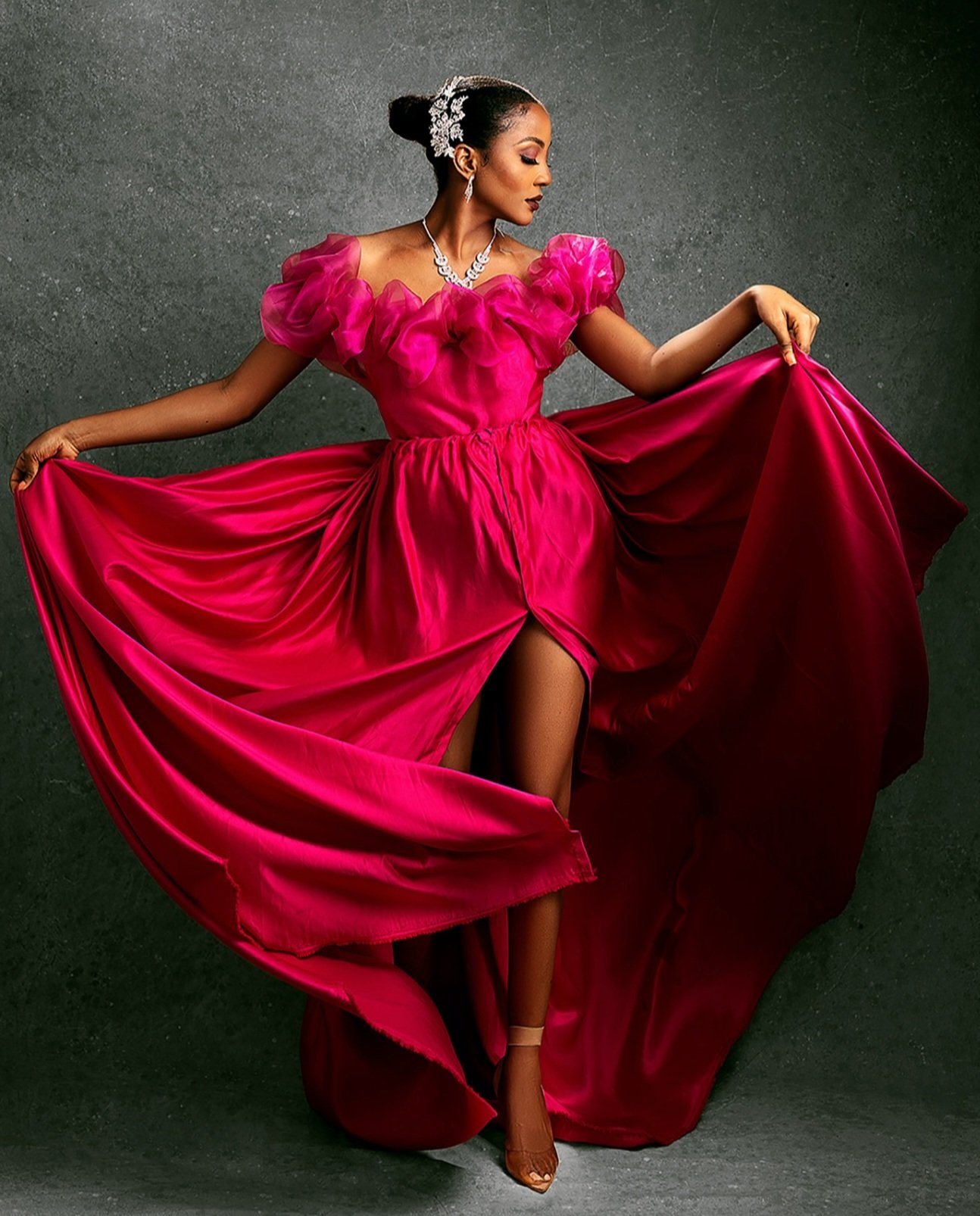 Fashion model posed in bold editorial makeup with structured studio lighting for a brand lookbook in Birmingham.