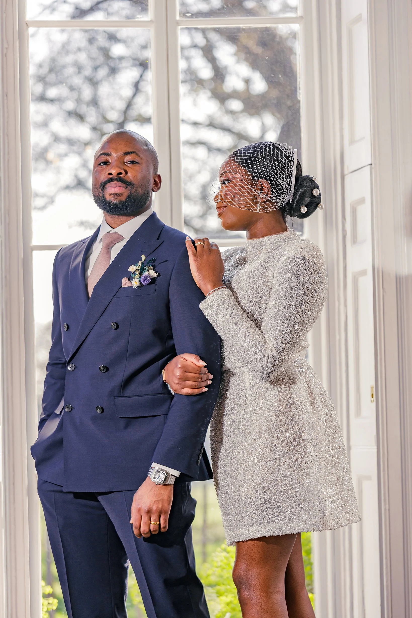 Bride and groom exchanging rings during an intimate civil ceremony at Merton Register Office in South West London.