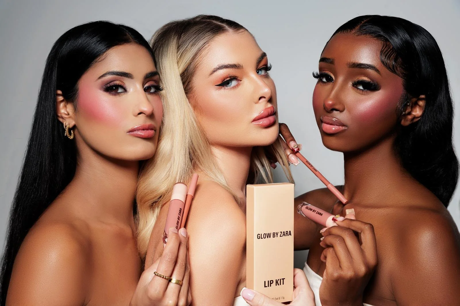 Model applying facial serum to skin with visible texture during an e-commerce beauty shoot in Manchester.