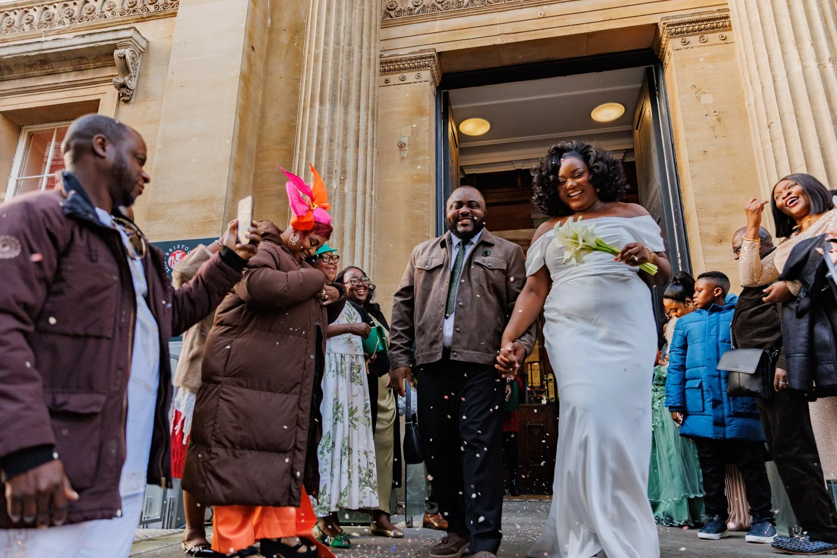 Newlyweds showered with confetti on the steps of The Old Council House on Corn Street in Bristol.