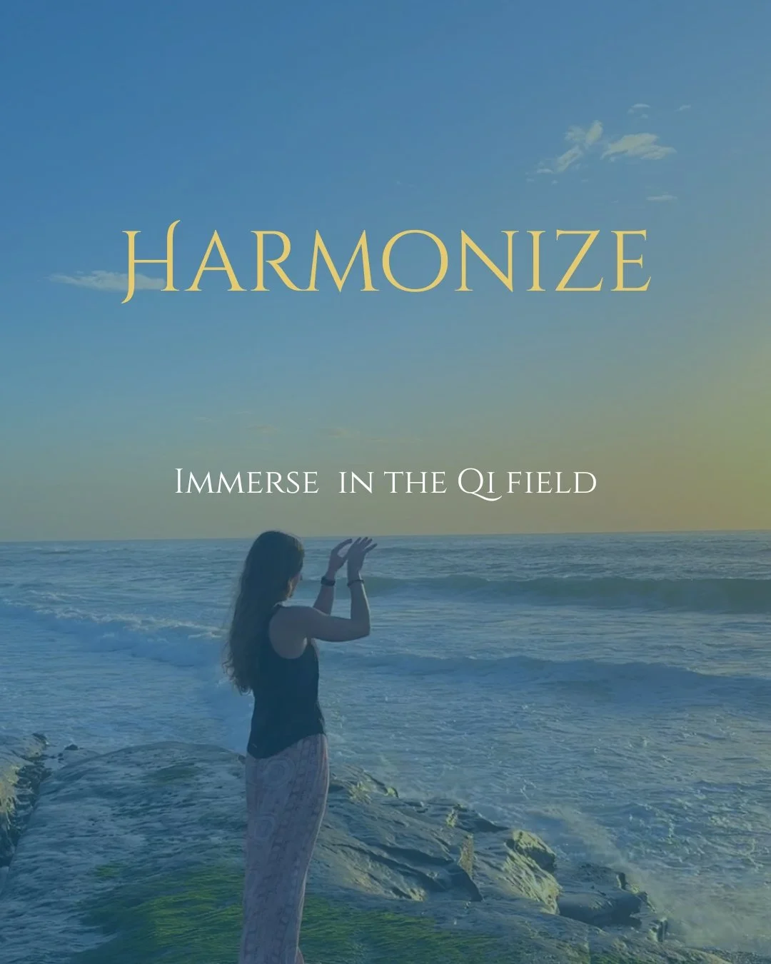 A woman standing on rocks near the ocean, with her hands raised in front of her, during sunset with a clear sky. Text overlay: 'Harmonize' and 'Immerse in the Qi Field'.