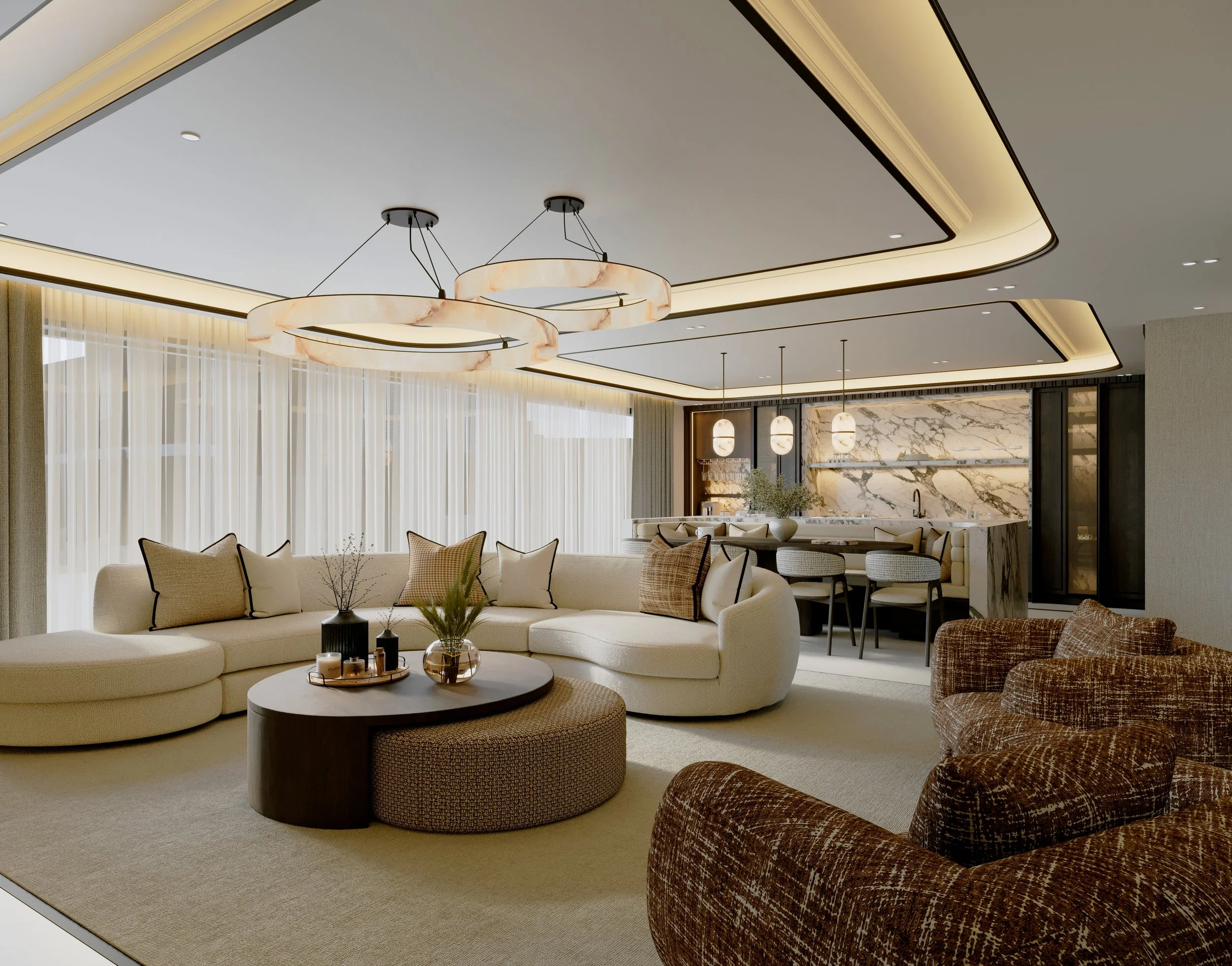 Modern living room with a curved beige sofa, a round coffee table with decorative candles and plants, patterned armchairs, large windows with sheer curtains, and elegant ceiling lighting fixtures.