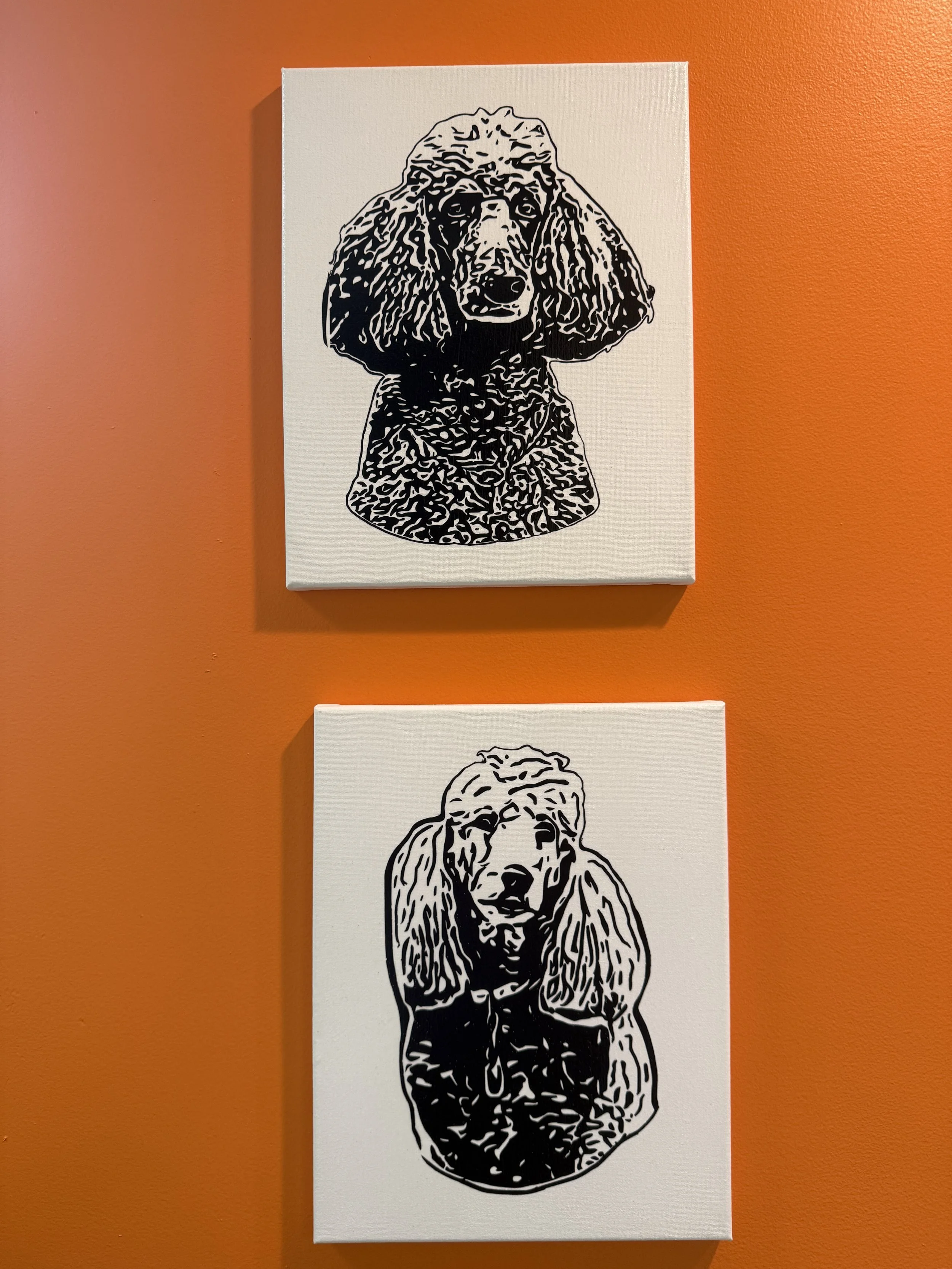 Black and white illustration of a dog with long ears, likely a Labrador Retriever, on a white canvas with an orange background.